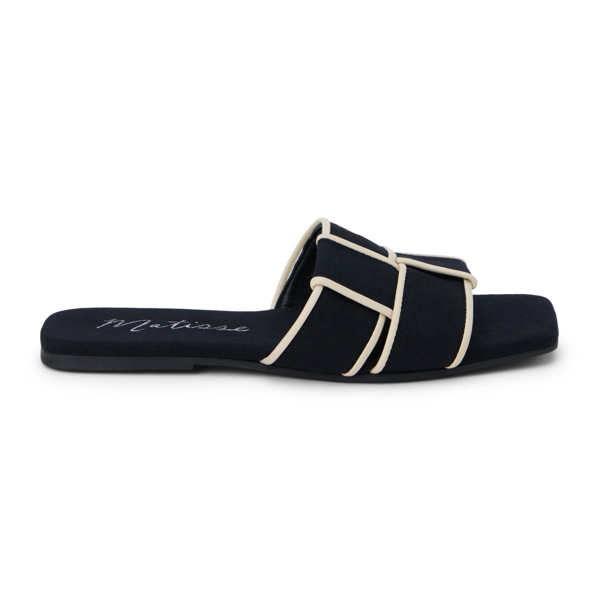 Flat sandal with woven upper.