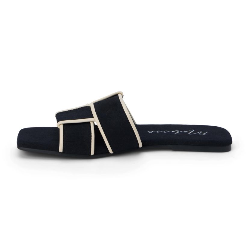 Flat sandal with woven upper.
