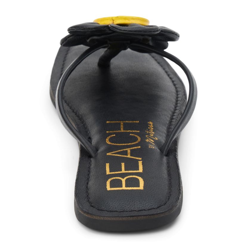 Square toe flip flop sandal with flower appliqué.