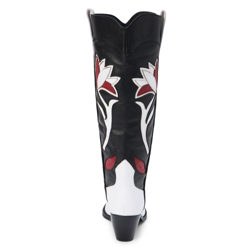 Western-inspired knee high boot with floral inlay.
