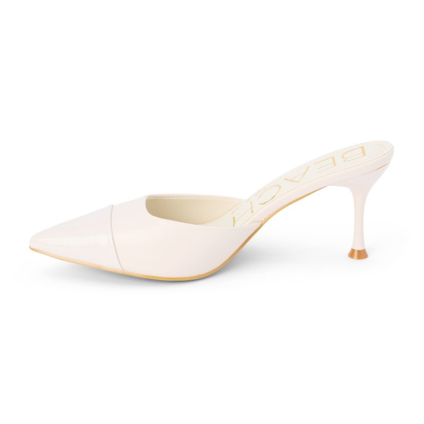 Vegan pointed toe mule on architectural heel.
