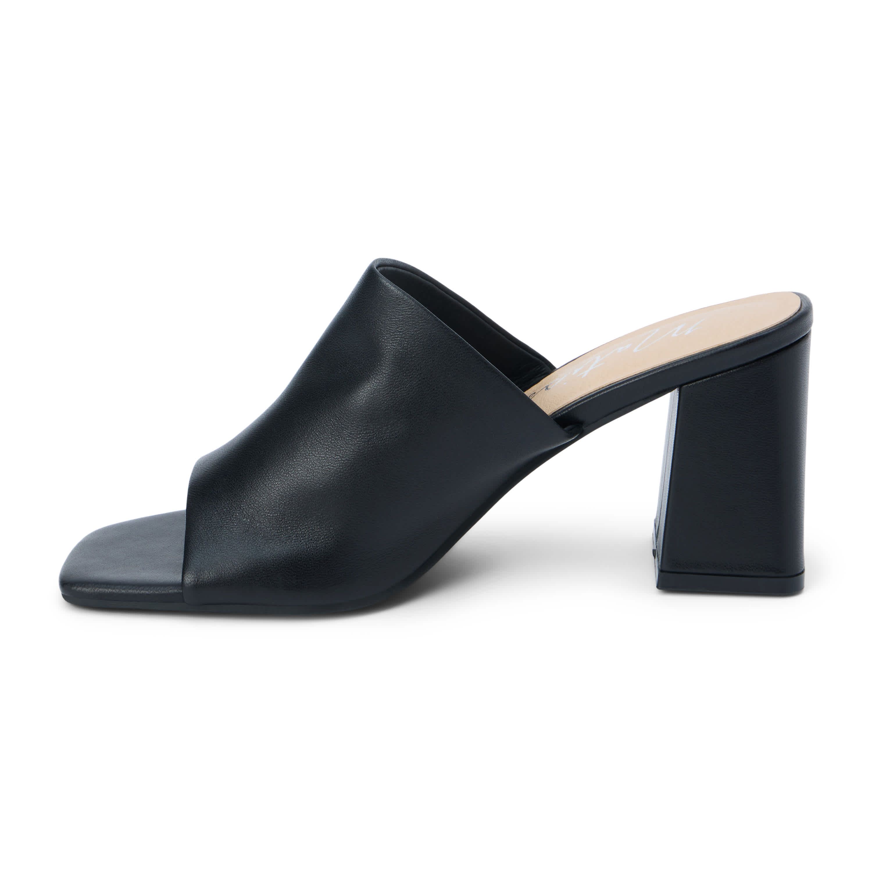 Block heeled sandal with unstructured upper.