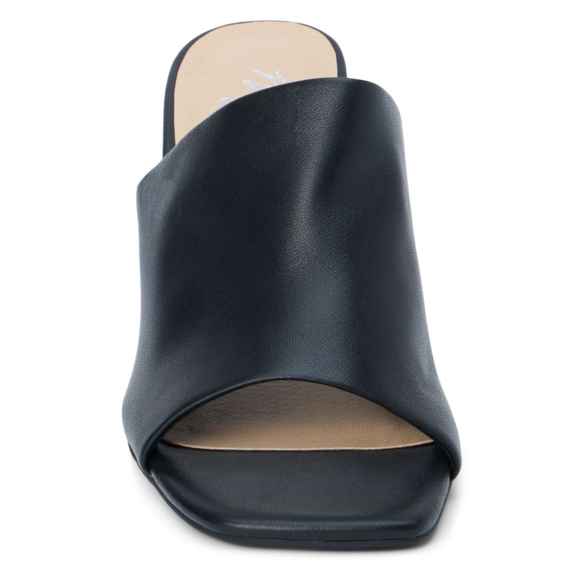 Block heeled sandal with unstructured upper.
