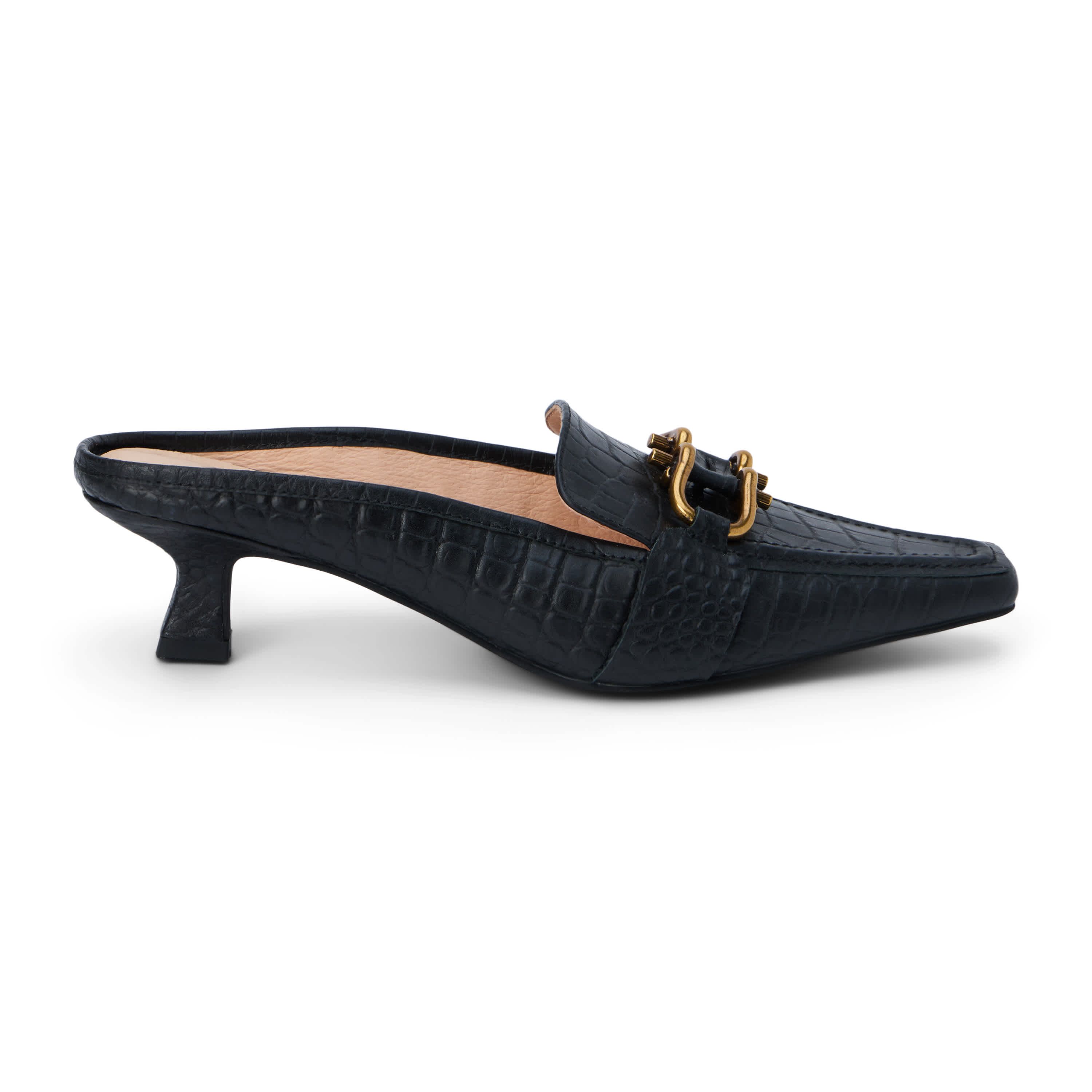 Pointed toe, kitten heel mule with hardware detail.