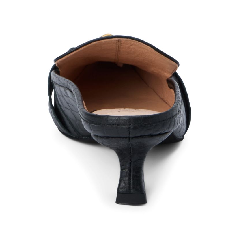Pointed toe, kitten heel mule with hardware detail.