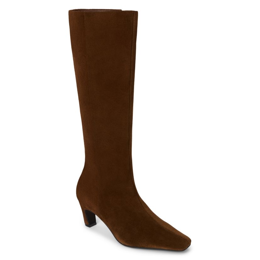 Simple knee high boot with architectural heel.
