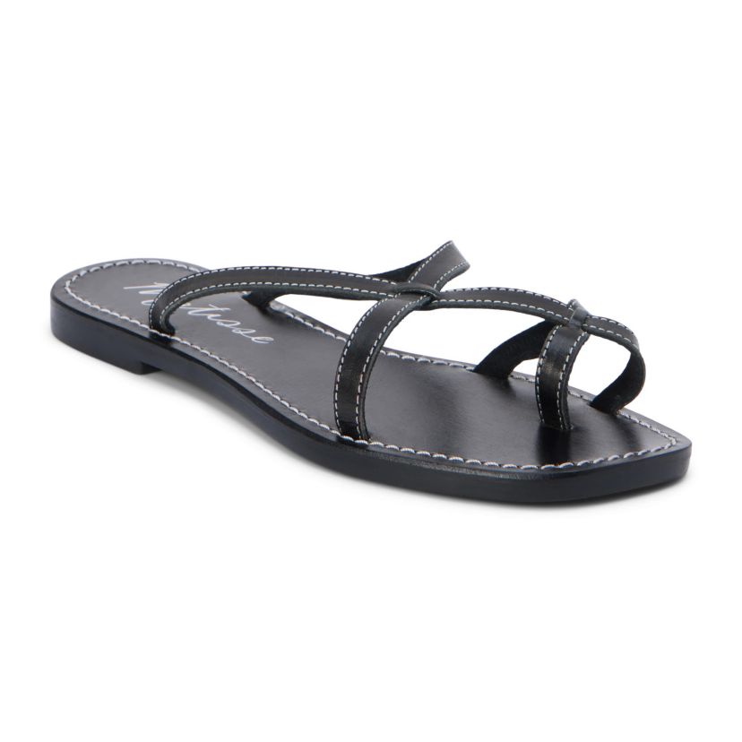Flat sandal with criss-cross straps and toe thong.