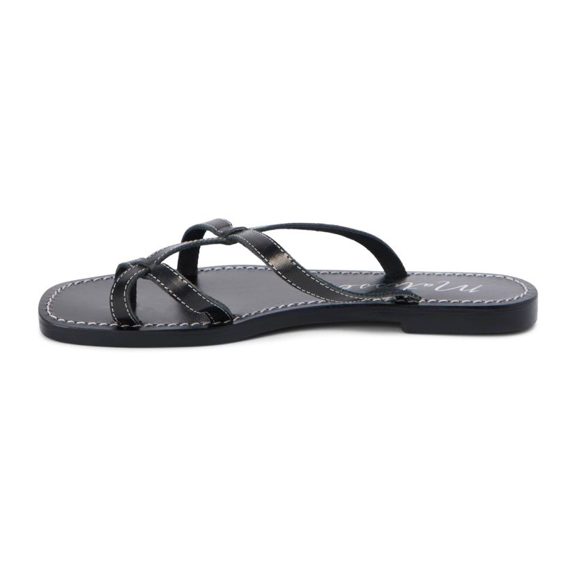 Flat sandal with criss-cross straps and toe thong.