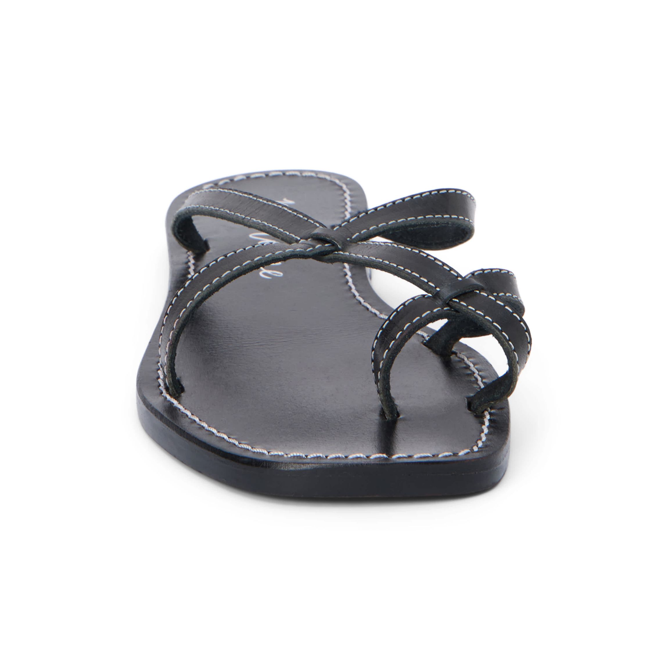 Flat sandal with criss-cross straps and toe thong.