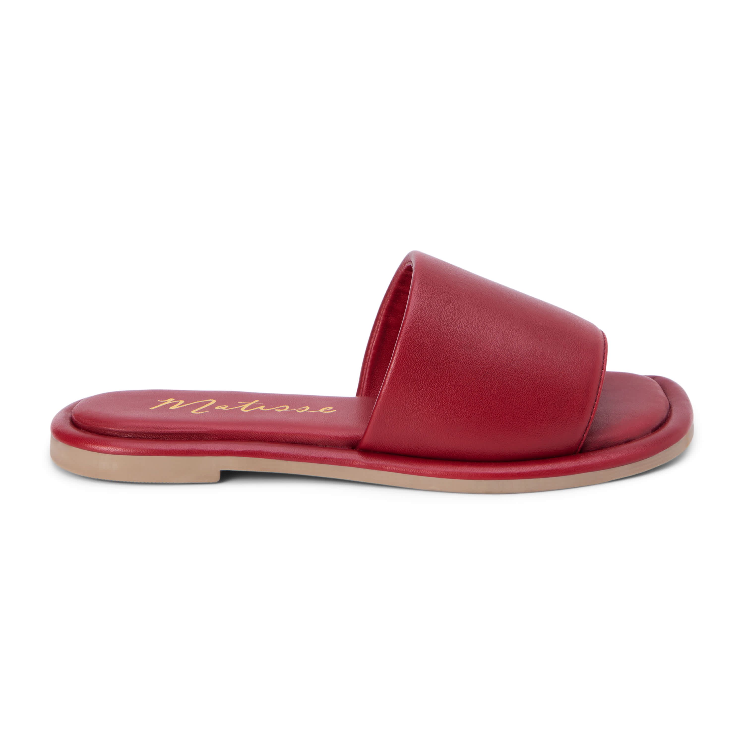 Flat sandal with puffy, one band upper.