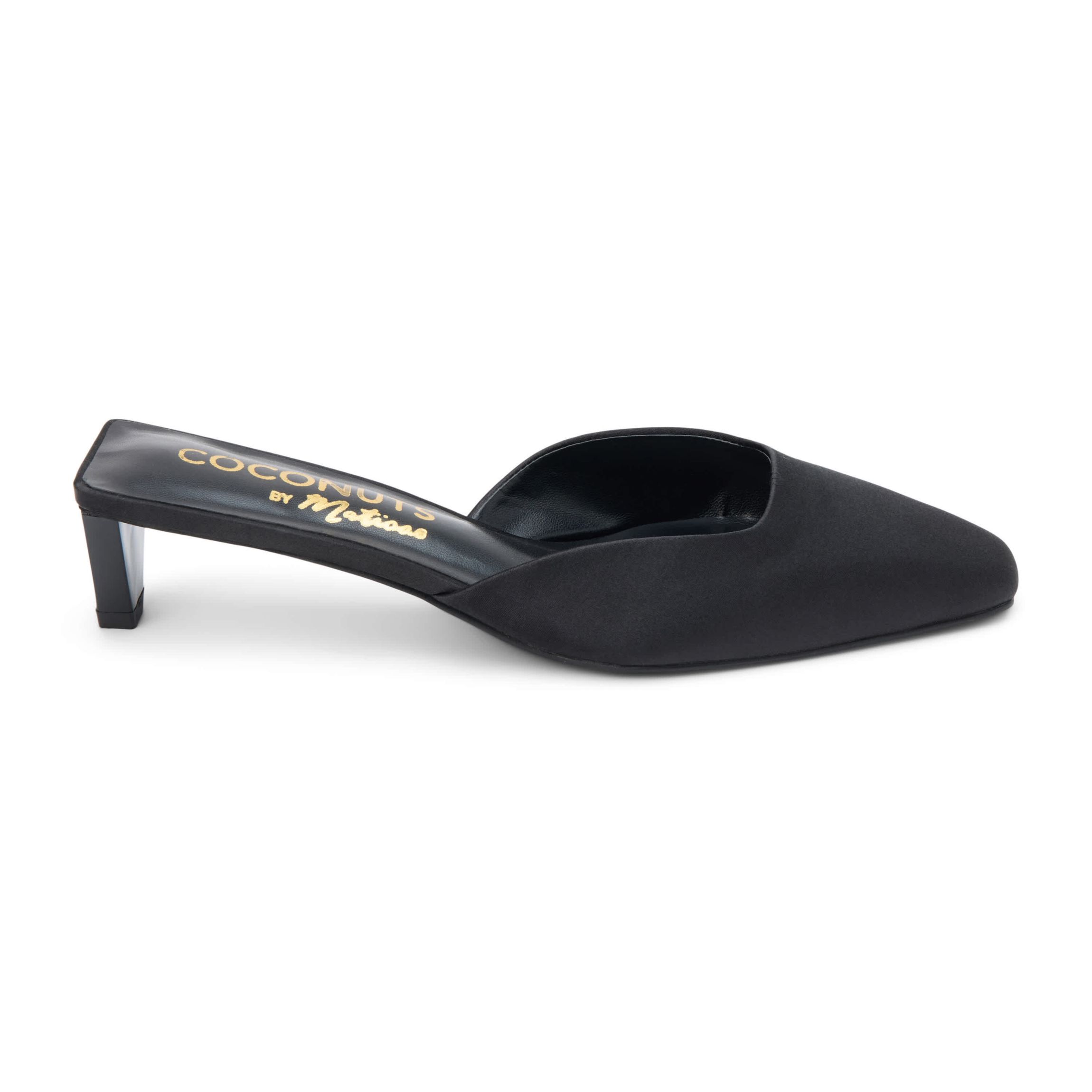 Vegan mule with elongated toe and architectural heel.