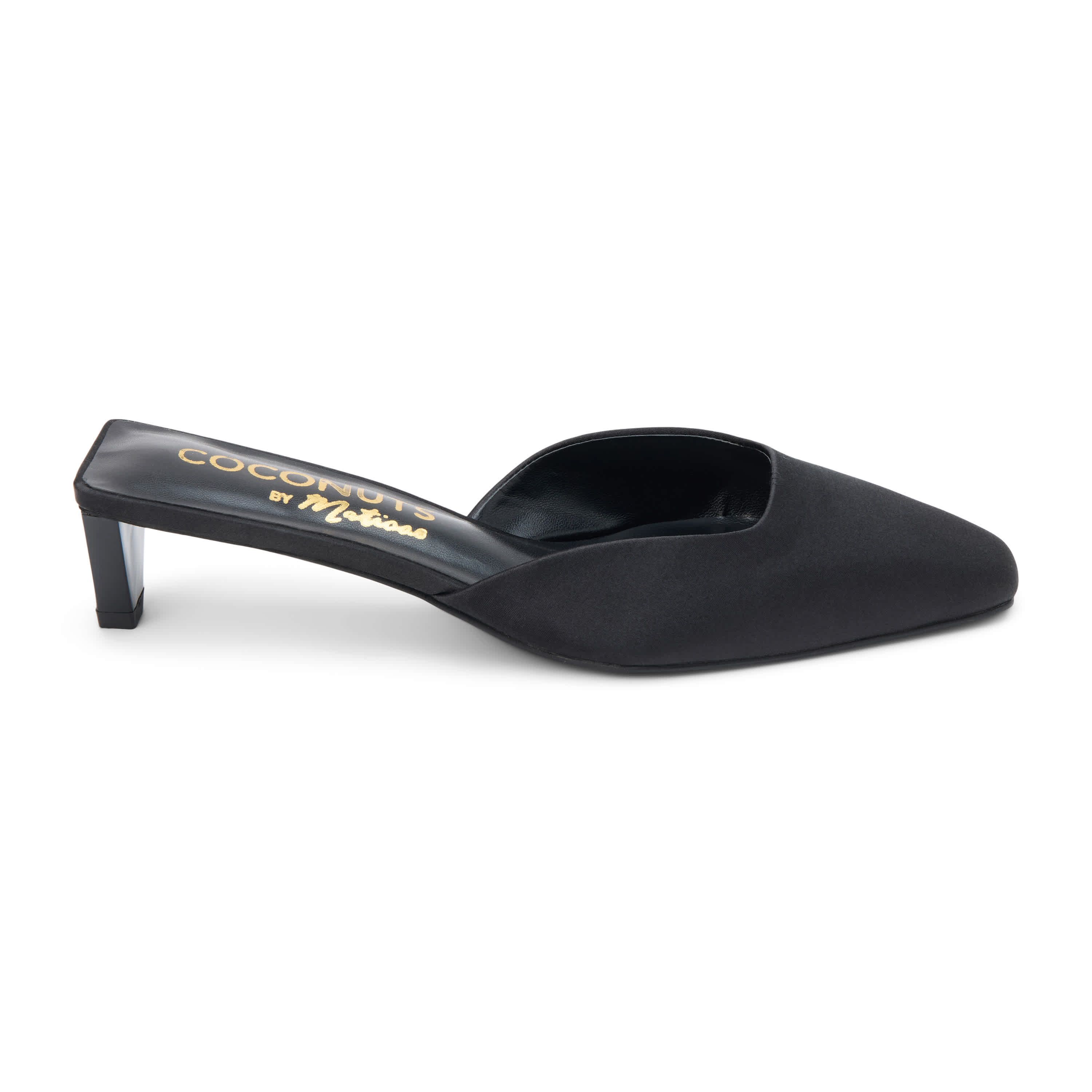 Vegan mule with elongated toe and architectural heel.