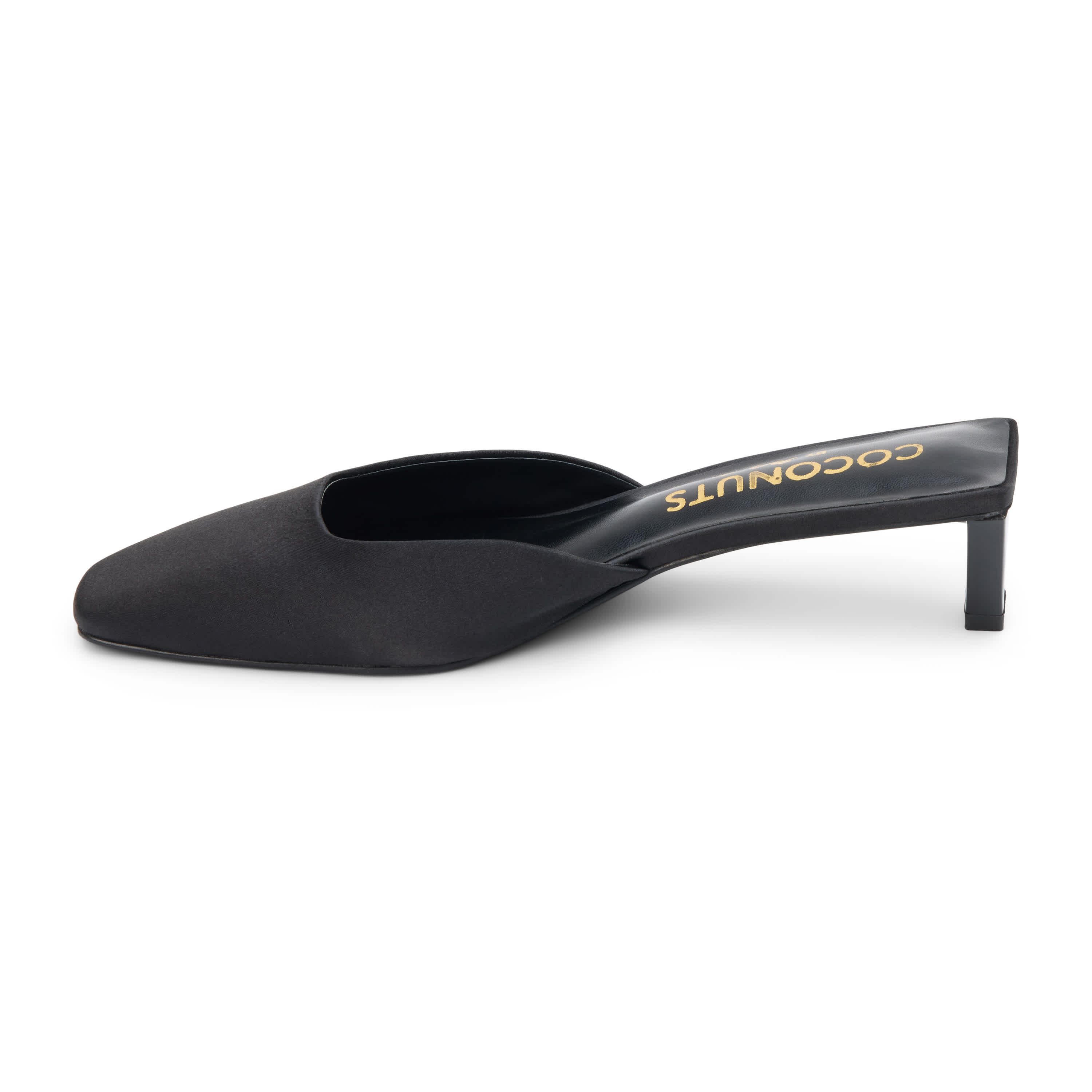 Vegan mule with elongated toe and architectural heel.
