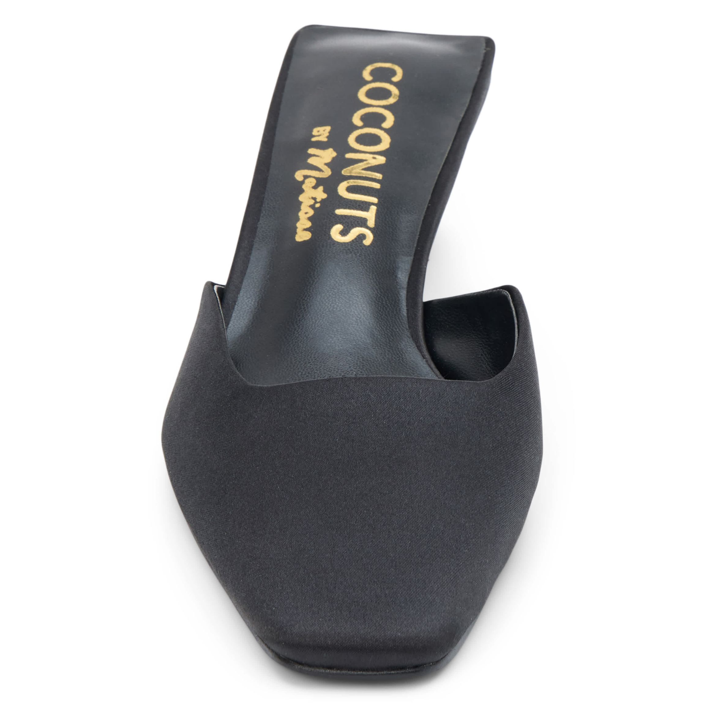 Vegan mule with elongated toe and architectural heel.