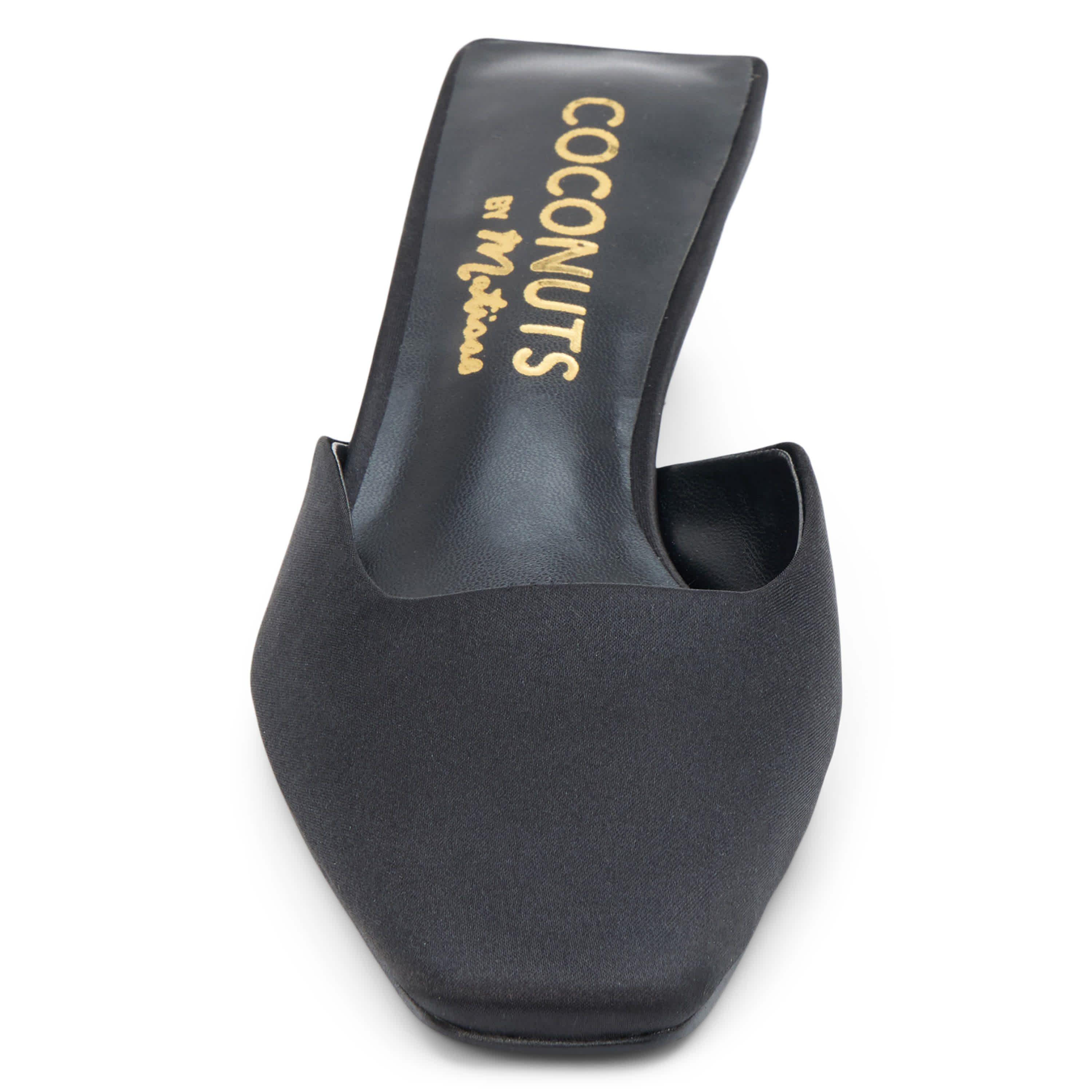 Vegan mule with elongated toe and architectural heel.