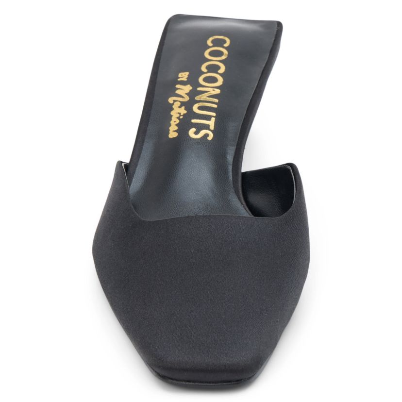 Vegan mule with elongated toe and architectural heel.