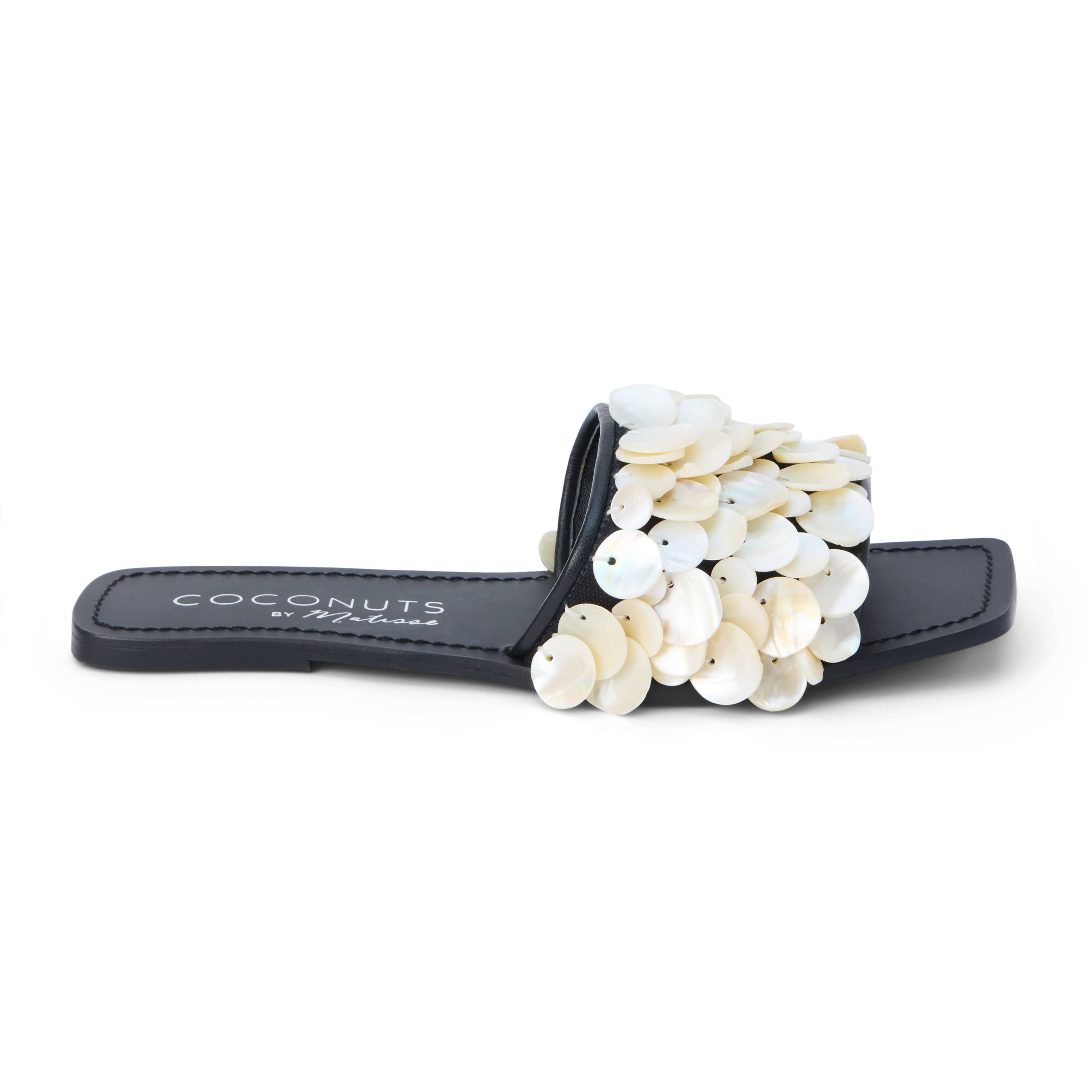 One band sandal with shell appliqué.