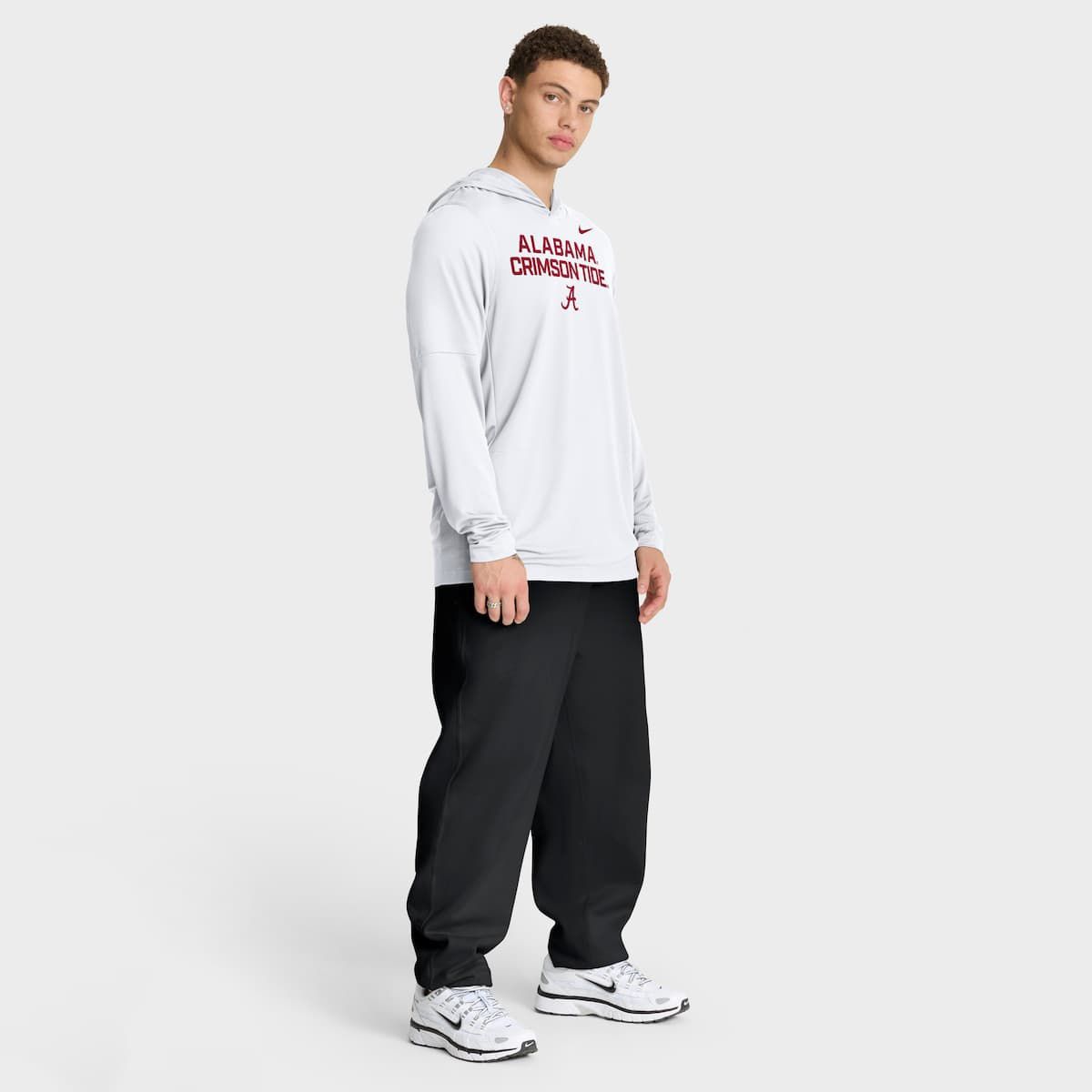 Alabama Crimson Tide NCAA Nike Alabama Tide 2025 Sideline Dri-FIT Long Sleeve Hoodie T-Shirt