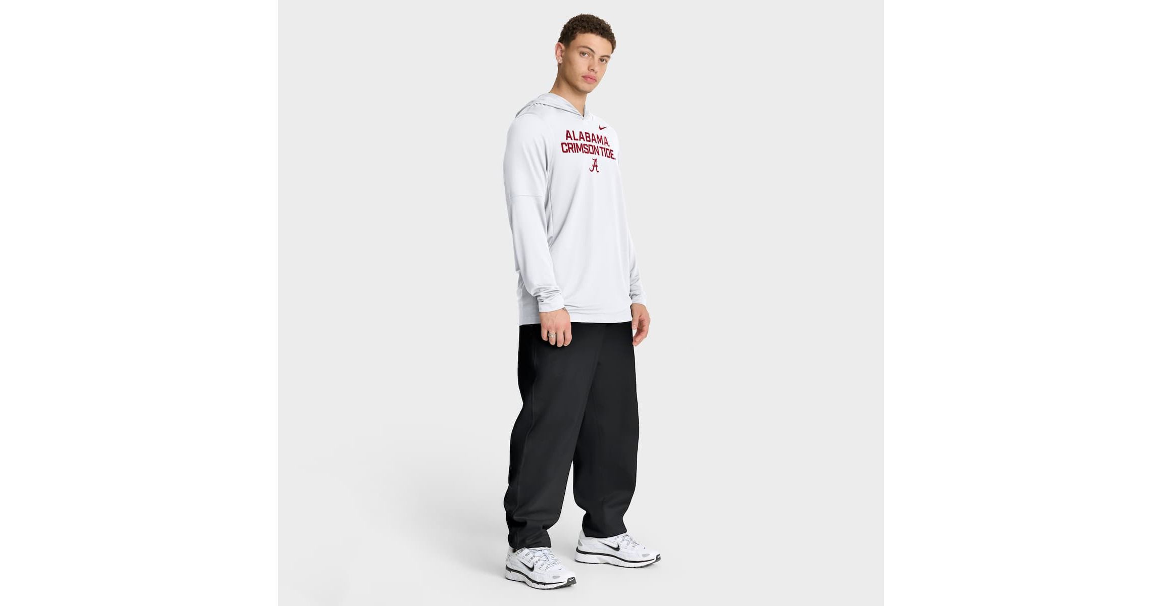 Alabama Crimson Tide NCAA Nike Alabama Tide 2025 Sideline Dri-FIT Long Sleeve Hoodie T-Shirt