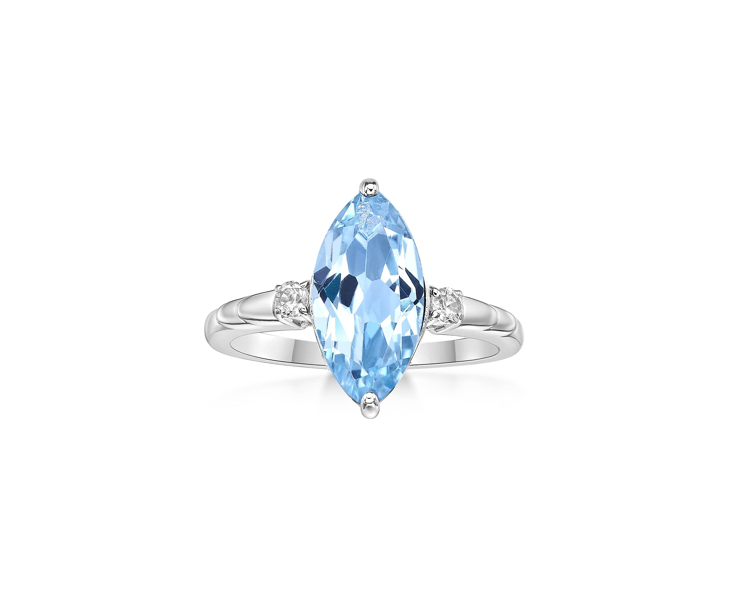 3 1/5 ct. t.w. Blue Topaz and 1/10 Created White Sapphire Ring in Sterling Silver