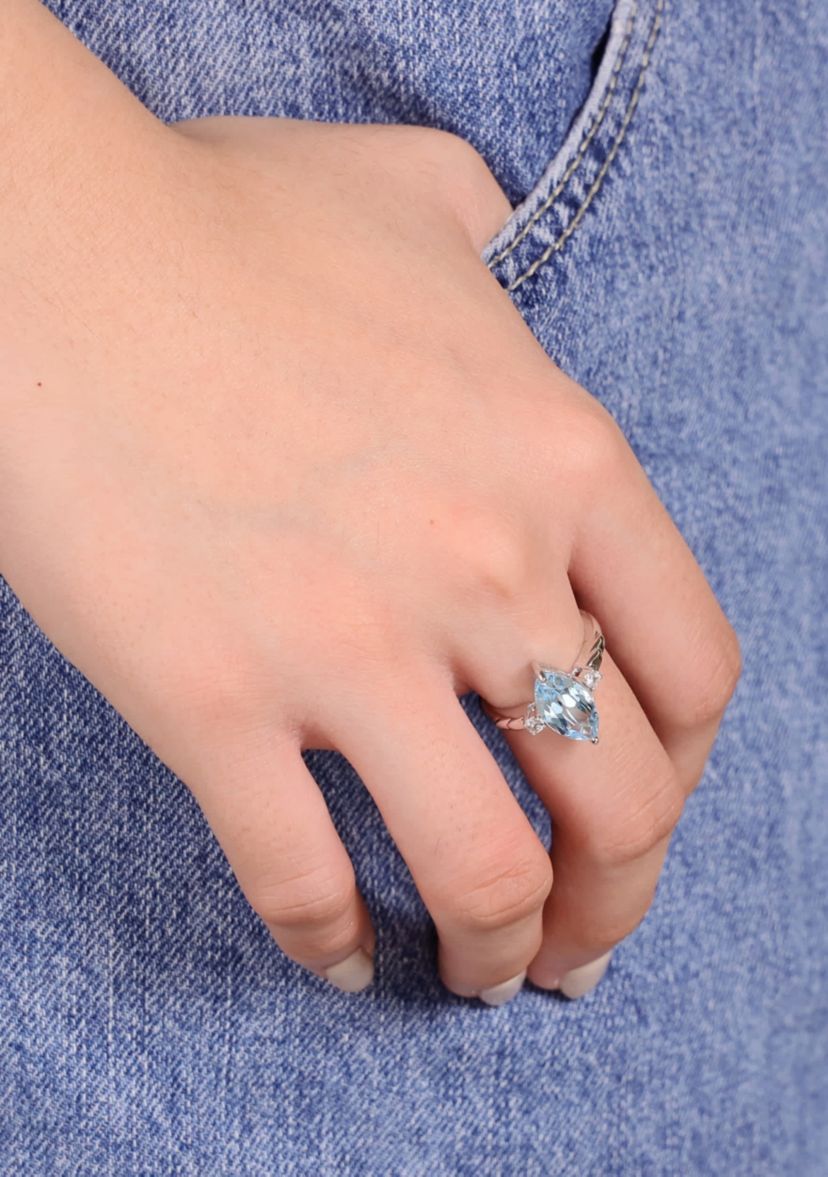 3 1/5 ct. t.w. Blue Topaz and 1/10 Created White Sapphire Ring in Sterling Silver