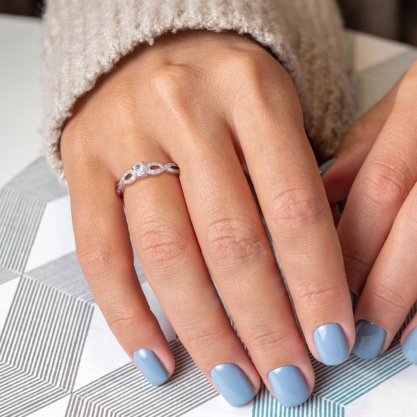 Lab Created Created White Sapphire and 1/10 CT TW Diamond Infinity Engagement Ring in Sterling Silver