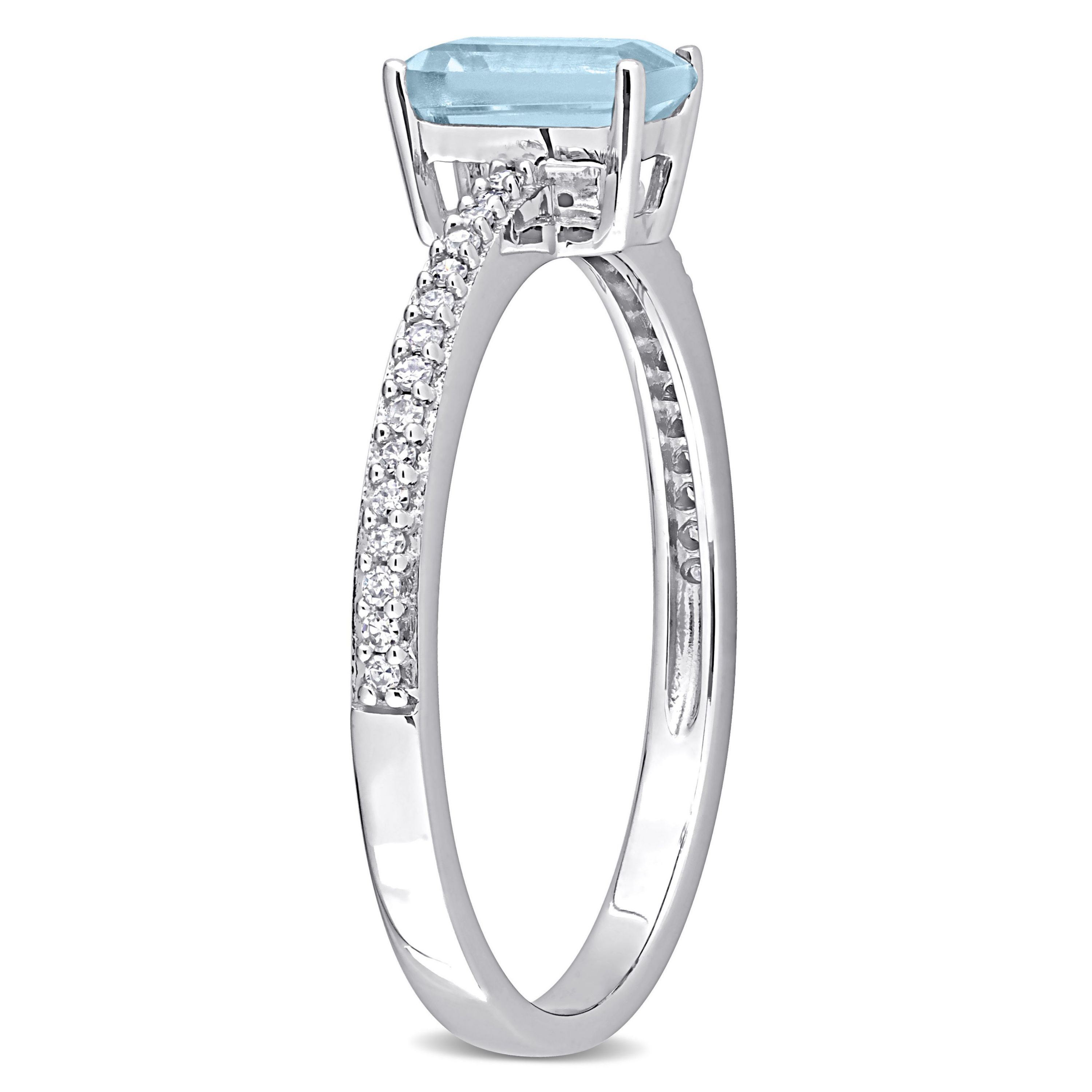 Octagonal Sky Blue Topaz and 1/10 CT TW Diamond Promise Ring in 10k White Gold