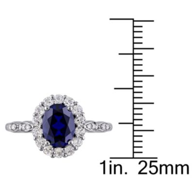 2.63 ct. t.g.w. Created Blue Sapphire, White Topaz and 1/10 t.w. Diamond Halo Ring 14K Gold