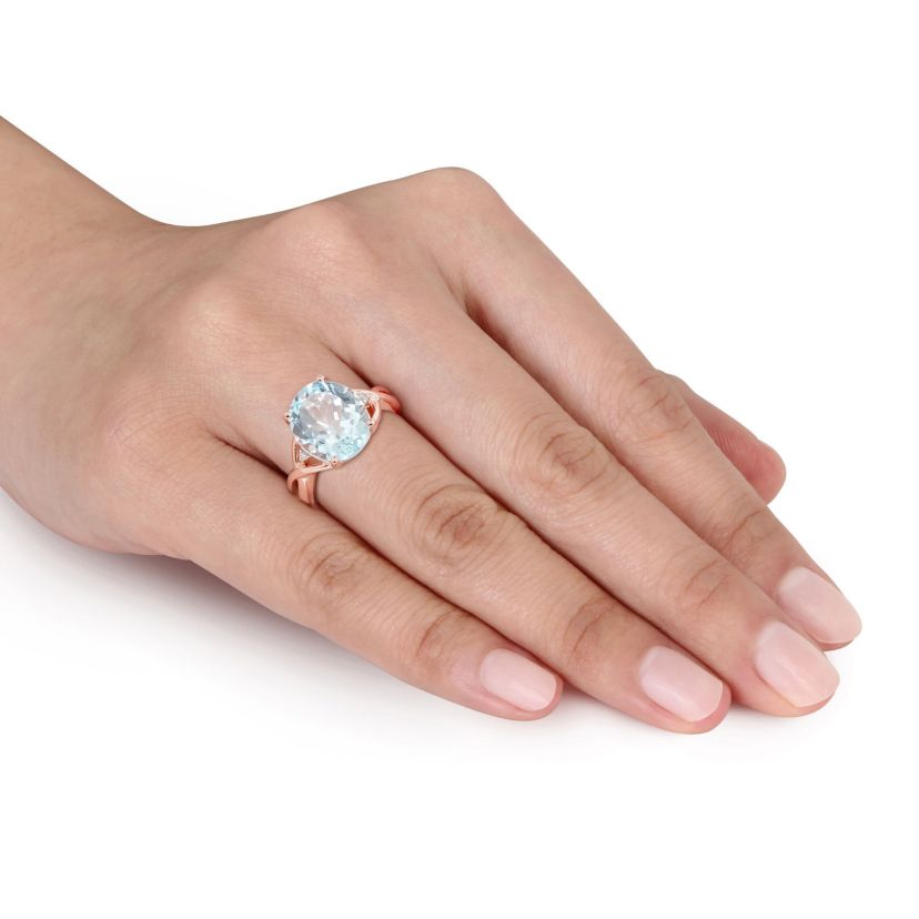 5.5 ct. t.g.w. Sky Blue Topaz and 1/10 ct. t.w. Diamond Cocktail Ring in Rose Plated Sterling Silver