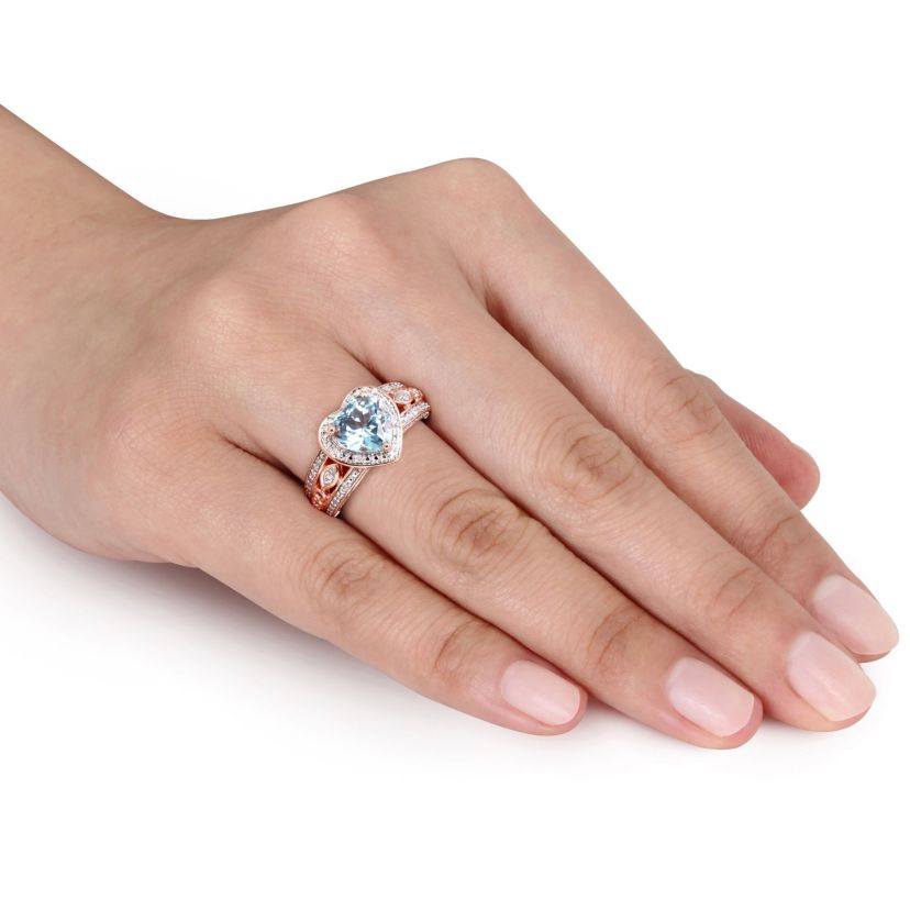 2 ct. t.g.w. Sky Blue Topaz and 1/10 ct. t.w. Diamond Heart Ring in Rose Plated Sterling Silver