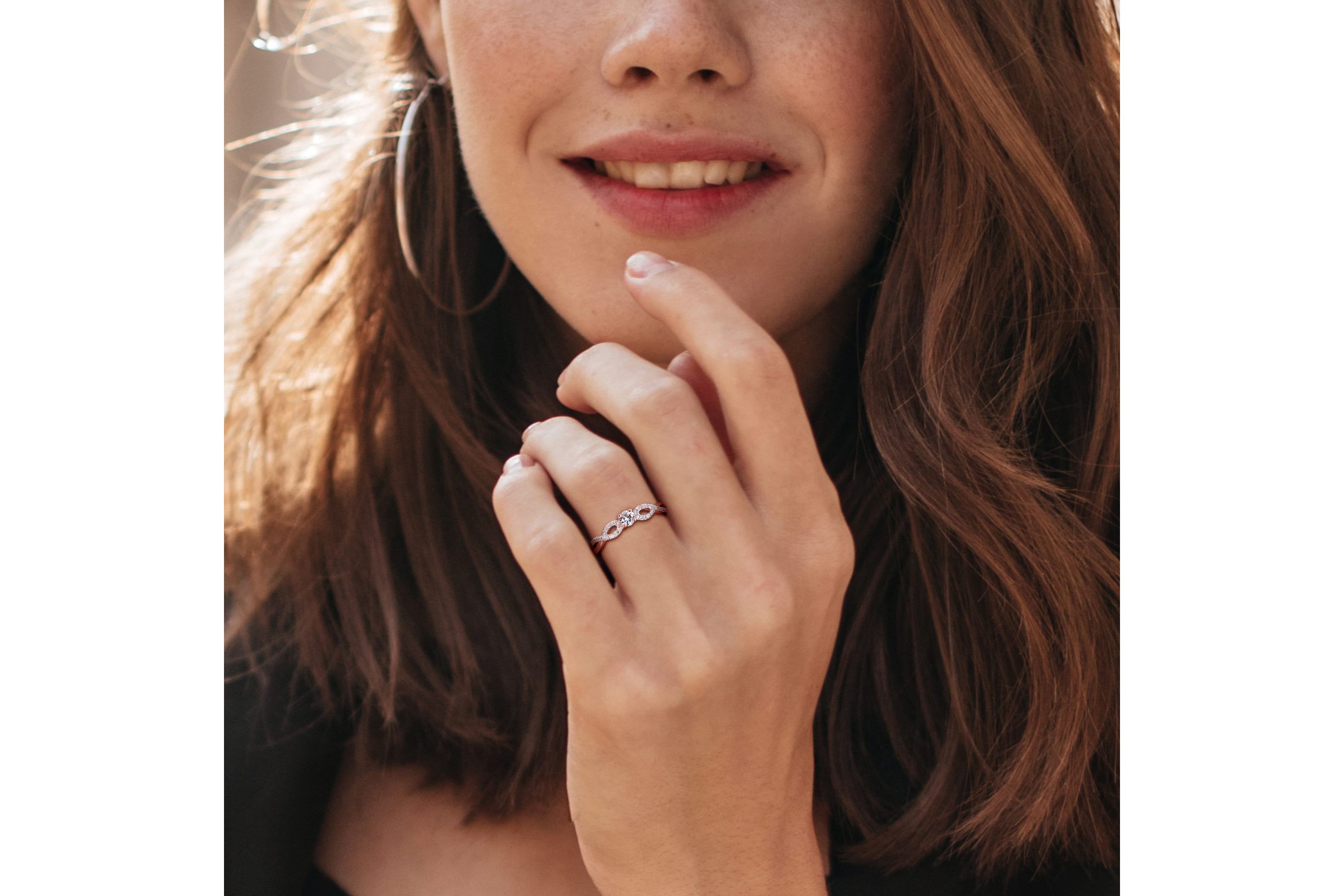 Lab Created Created White Sapphire and 1/10 ct. t.w. Diamond Infinity Ring in Rose Plated Sterling Silver