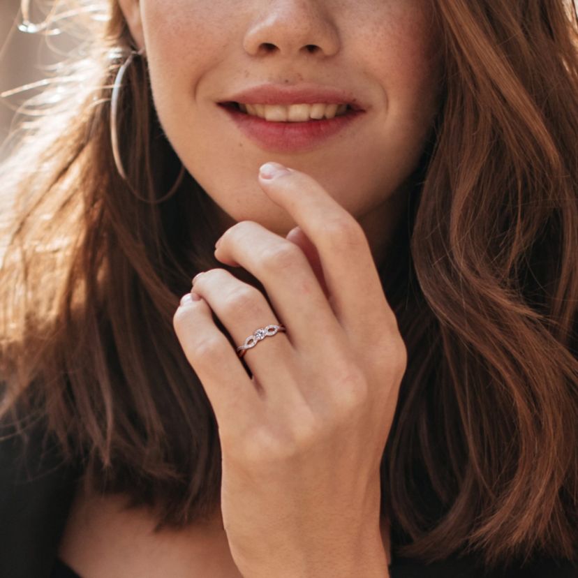 Lab Created Created White Sapphire and 1/10 ct. t.w. Diamond Infinity Ring in Rose Plated Sterling Silver