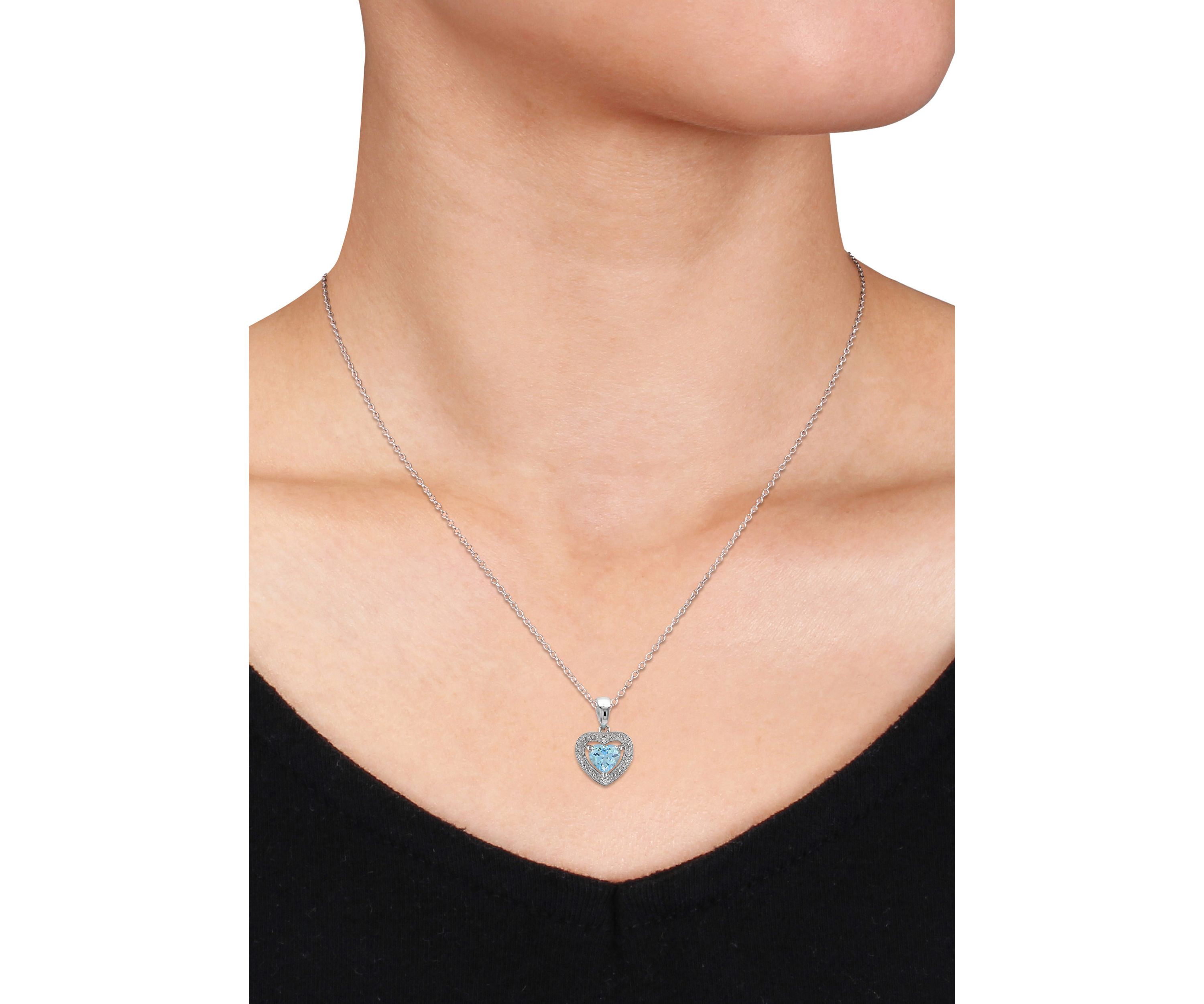 Sterling Silver Blue Topaz and Diamond Pendant