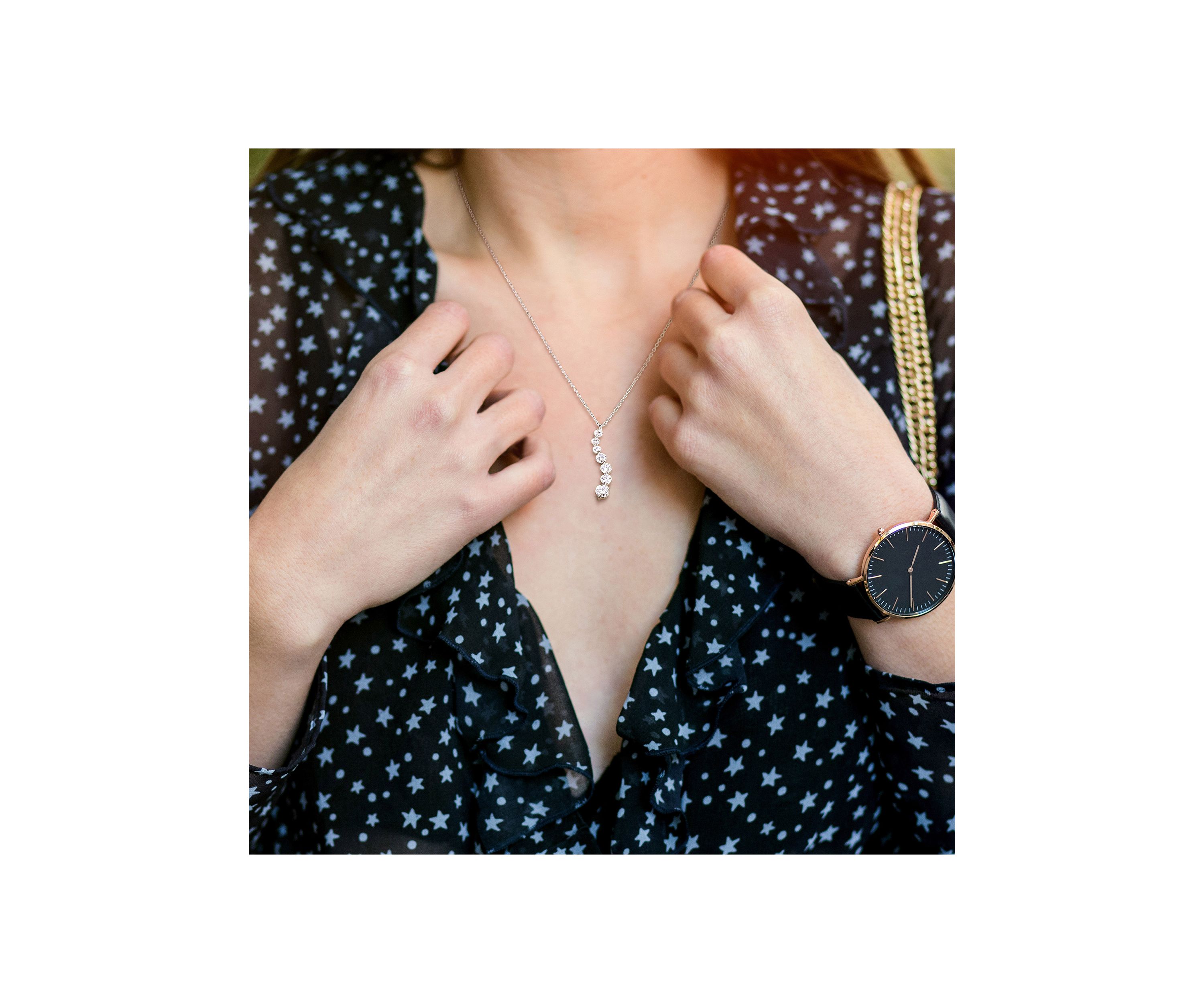 1.5 ct. t.w. Created Moissanite Graduated Pendant with Chain in Sterling Silver