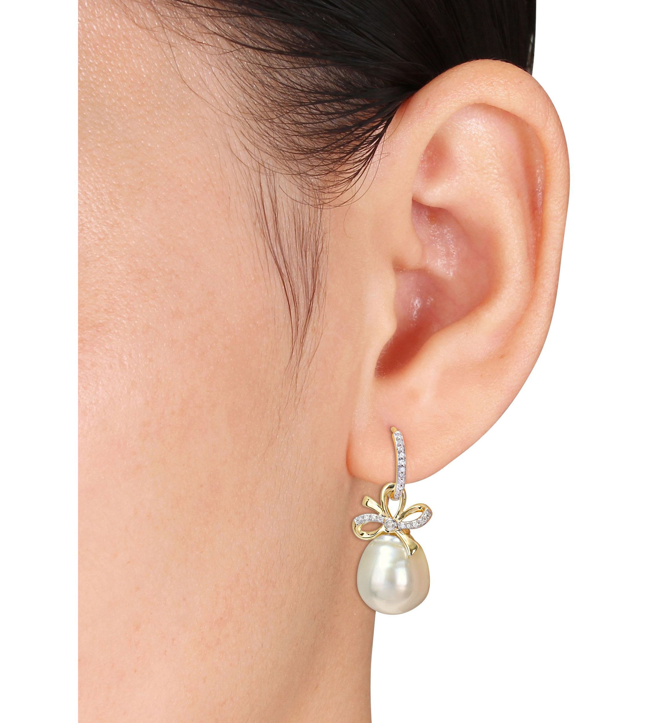 12-12.5MM South Sea Cultured Pearl and 1/4 CT TW Diamond Bow Huggie Earrings in 14k Yellow Gold