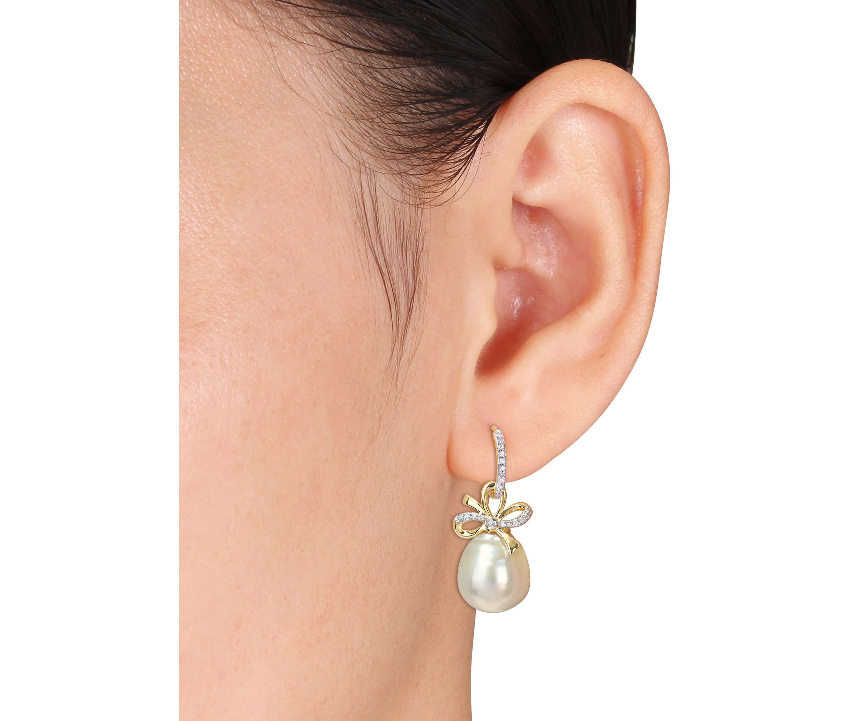 12-12.5MM South Sea Cultured Pearl and 1/4 CT TW Diamond Bow Huggie Earrings in 14k Yellow Gold