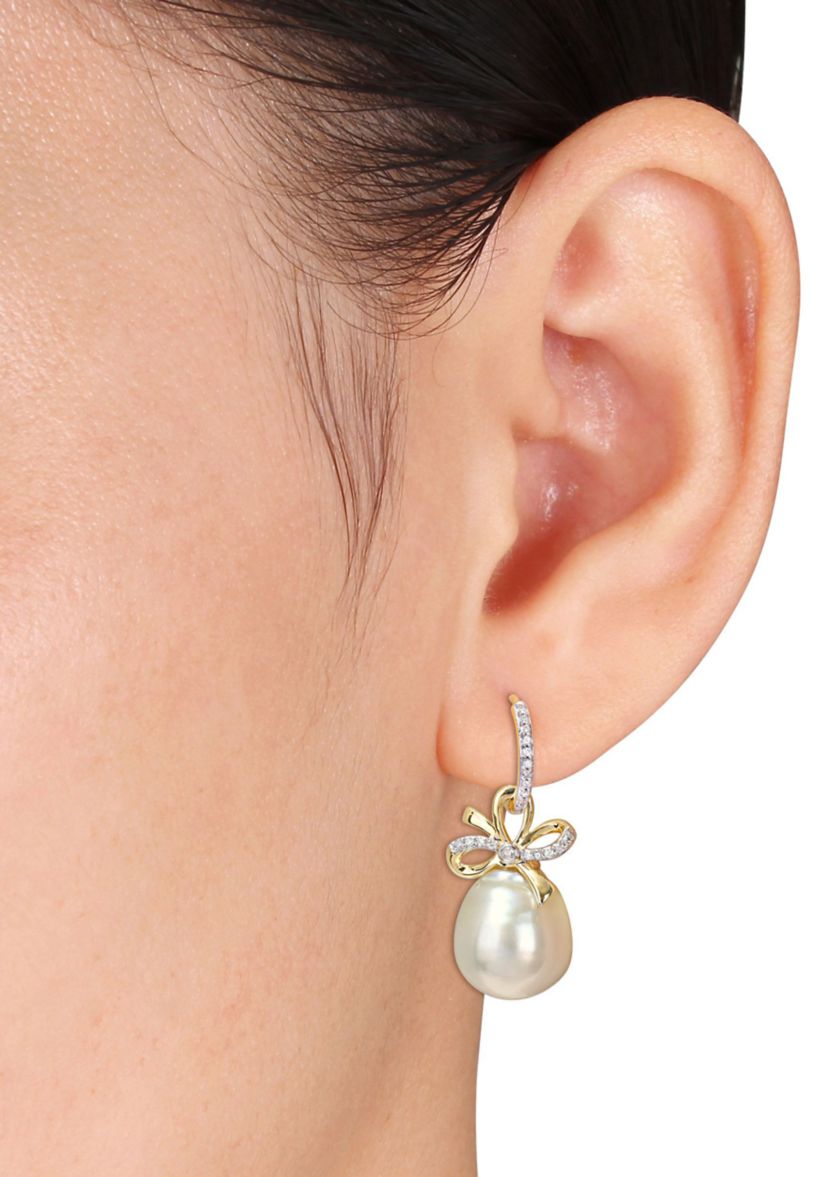 12-12.5MM South Sea Cultured Pearl and 1/4 CT TW Diamond Bow Huggie Earrings in 14k Yellow Gold