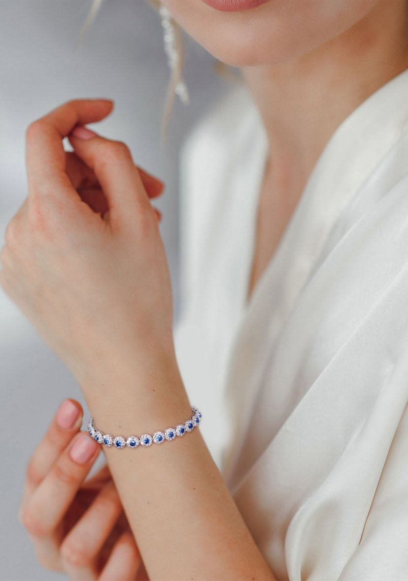 Lab Created 11.28 ct. t.g.w. Created Blue and White Sapphire Halo Tennis Bracelet in Sterling Silver