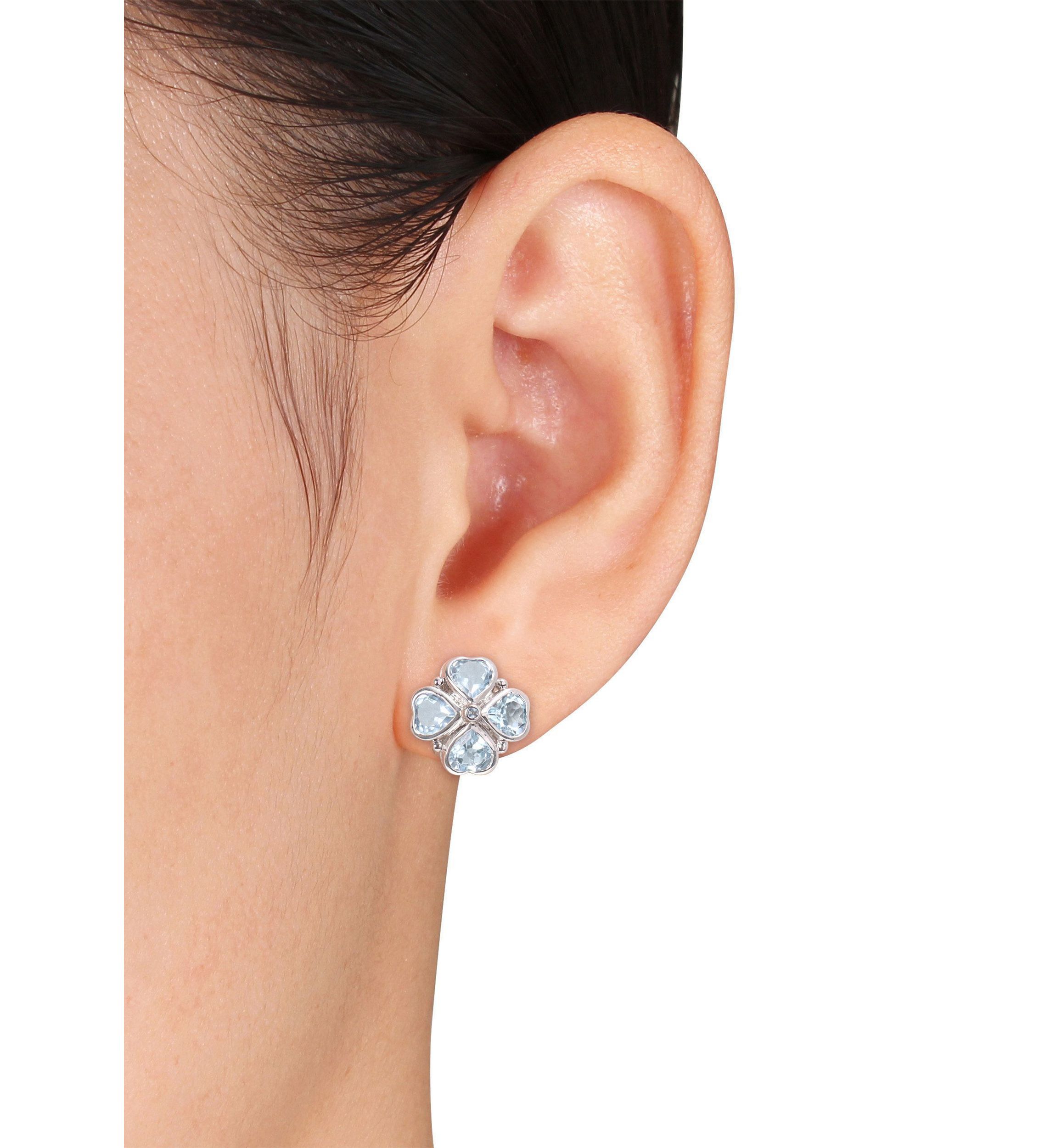4.43 ct. t.g.w. Sky Blue Topaz Floral Clipback Earrings in Sterling Silver