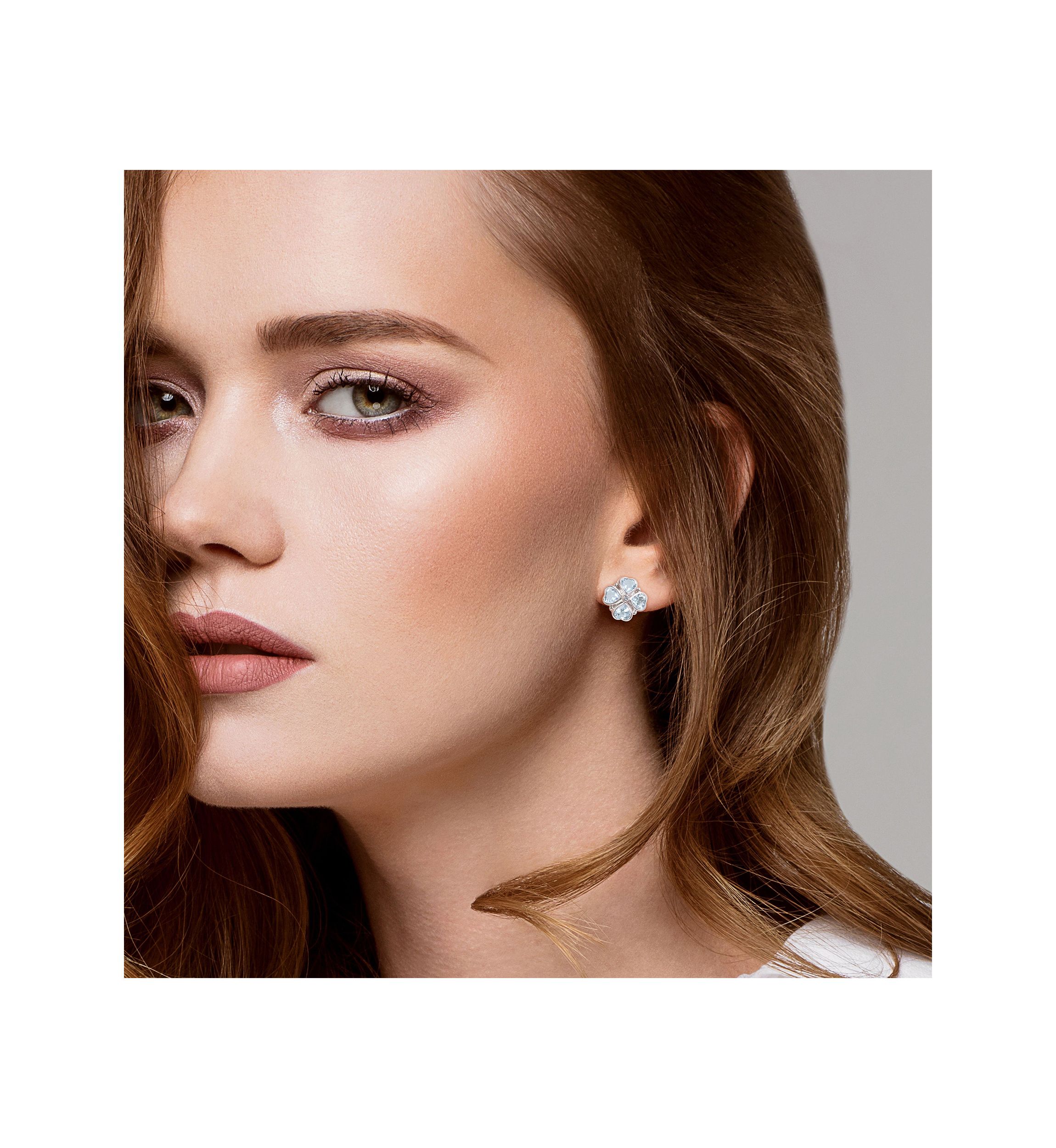 4.43 ct. t.g.w. Sky Blue Topaz Floral Clipback Earrings in Sterling Silver