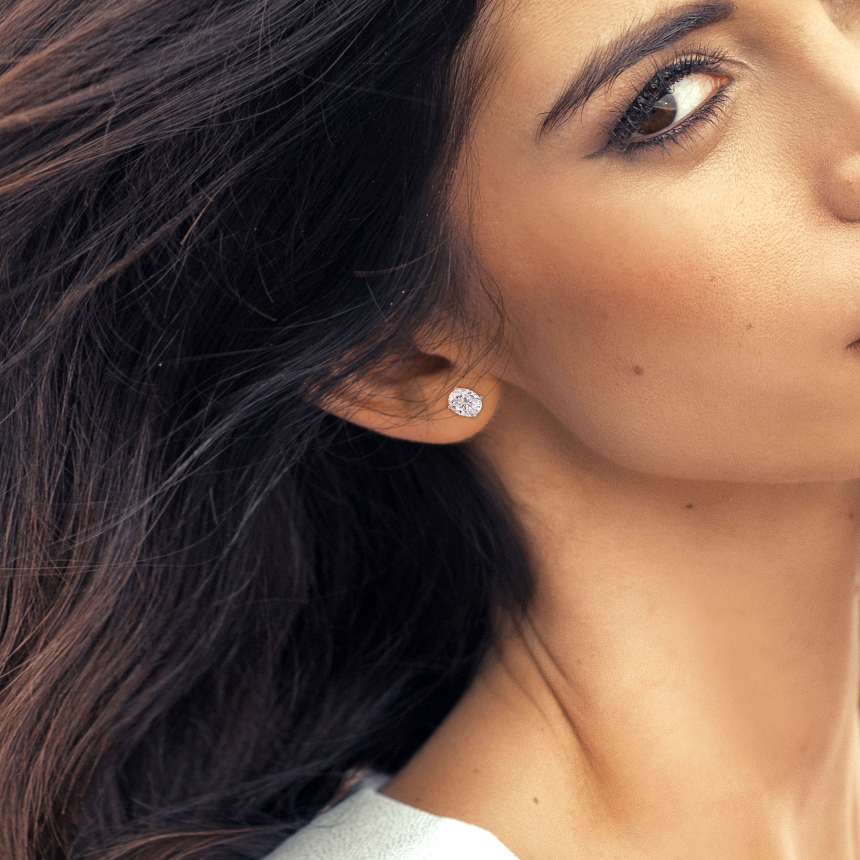 Lab Created 4 CT TGW Oval Created Moissanite Stud Earrings with Heart Detail in Sterling Silver