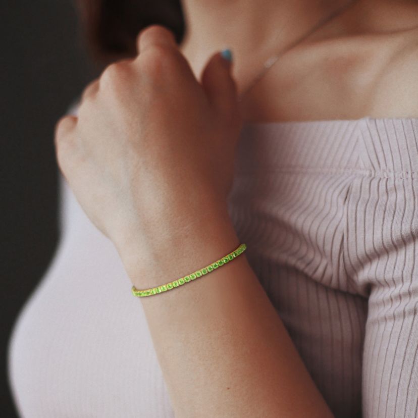 4.59 ct. t.g.w. Peridot Tennis Bracelet in Yellow Plated Sterling Silver