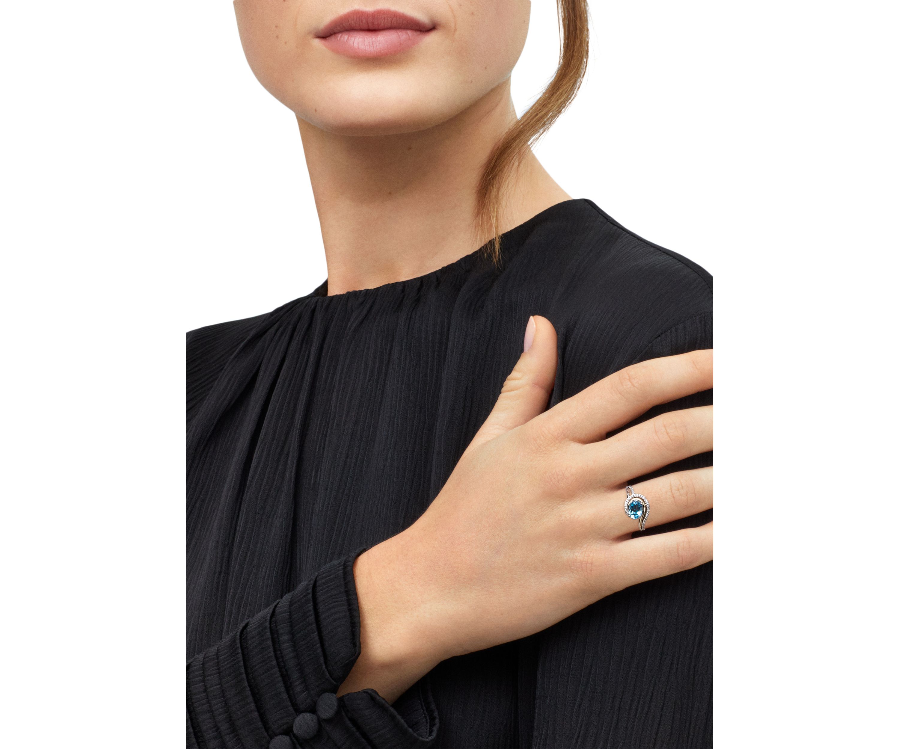 1/8 ct. t.w. Diamond and Swiss Blue Topaz Ring in Two Tone Metal