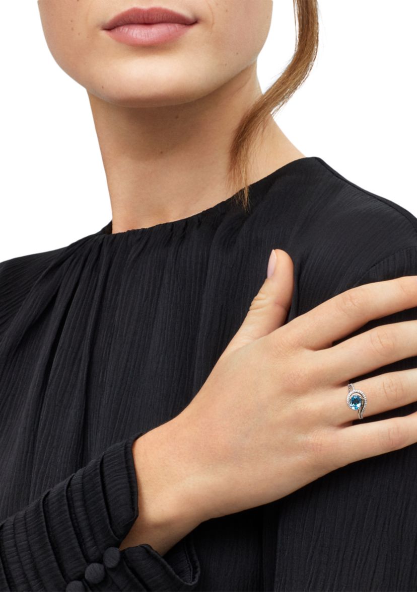 1/8 ct. t.w. Diamond and Swiss Blue Topaz Ring in Two Tone Metal