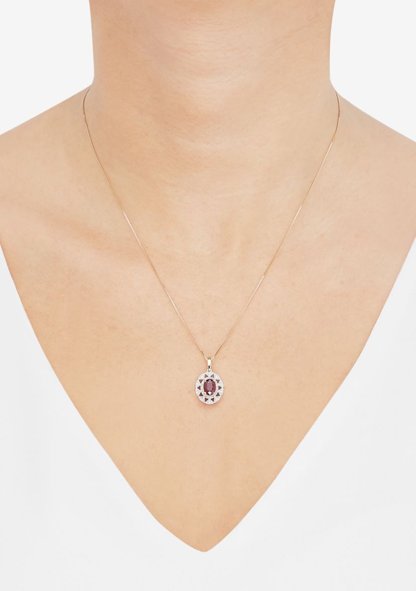 1/10 ct. t.w. Diamond and Ruby Oval Drop Pendant Necklace with 18" Box Chain in 10K Yellow Gold
