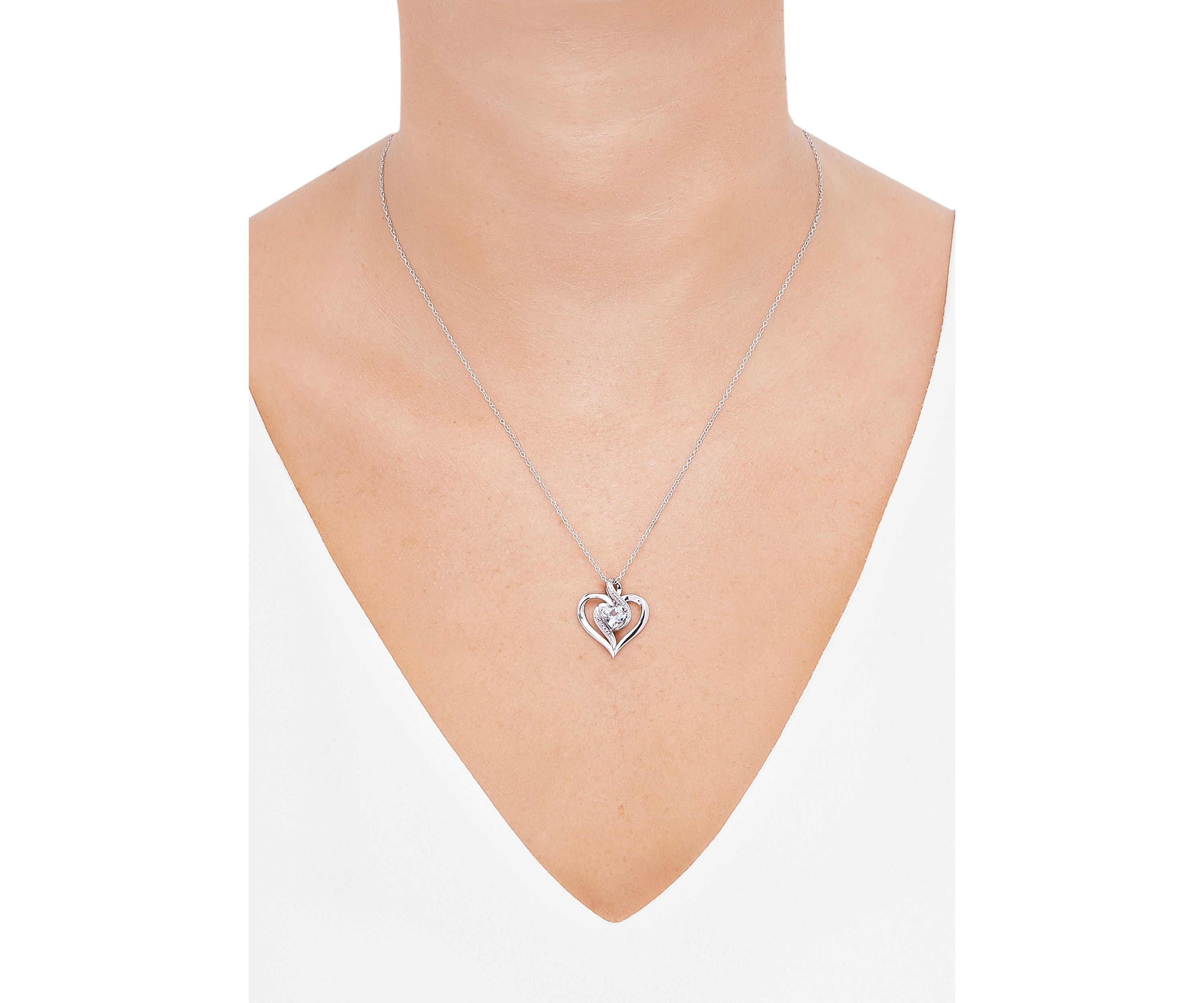 1/10 ct. t.w. Diamond and Aquamarine Heart Pendant Necklace with 18" Cable Chain in Sterling Silver