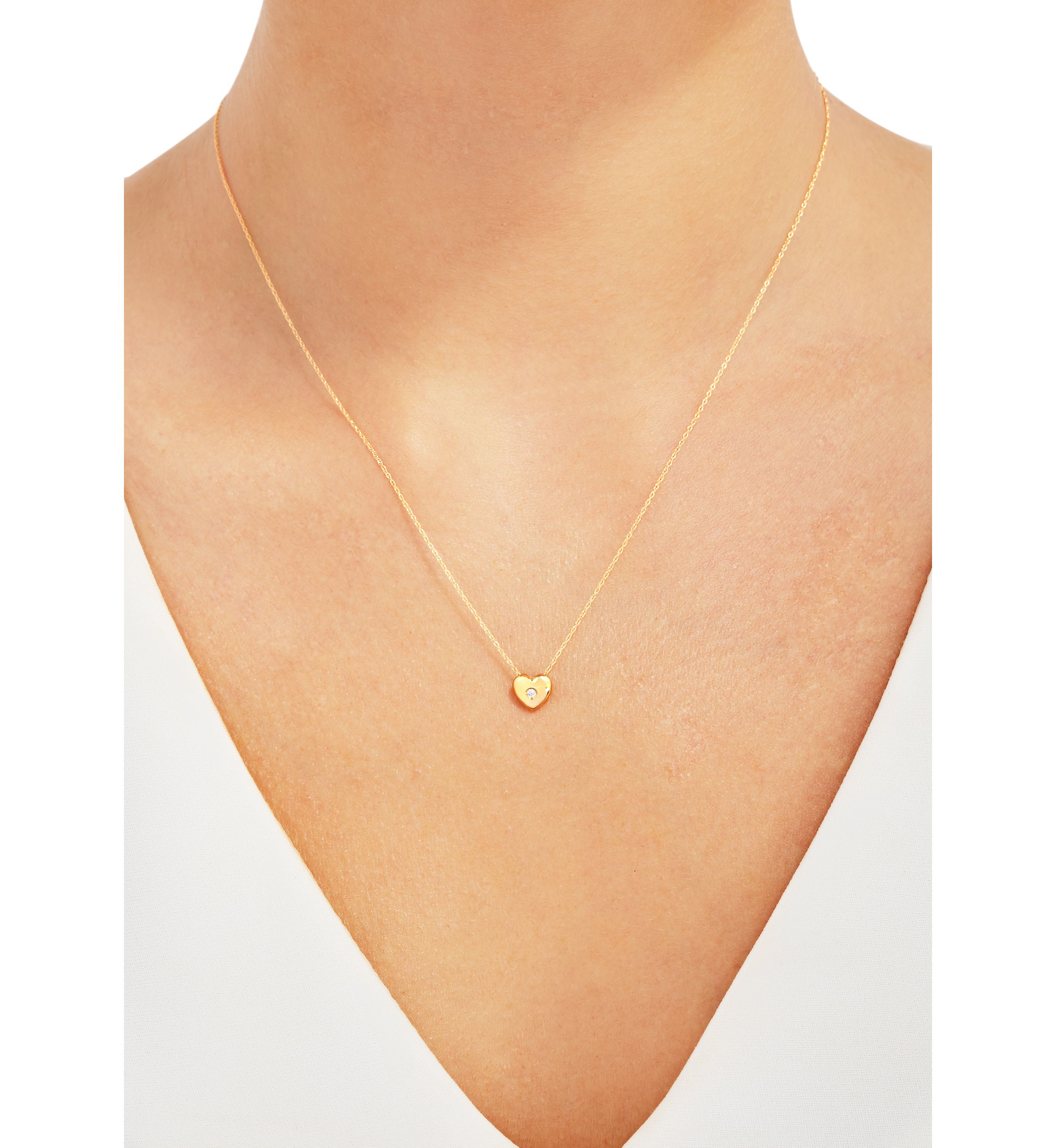  1/10 ct. t.w. Diamond Heart Pendant Necklace in 10K Yellow Gold 