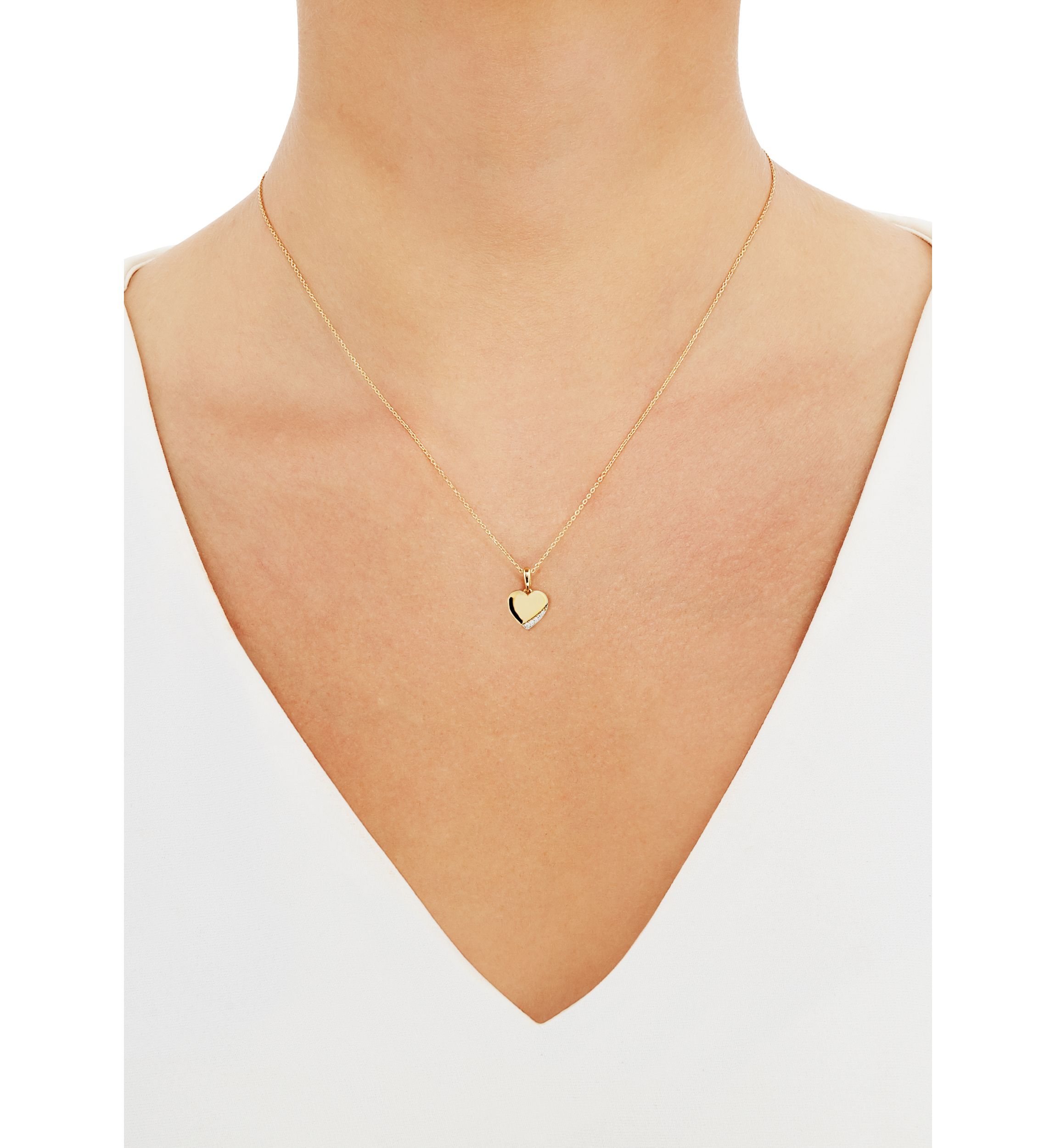  1/10 ct. t.w. Diamond Heart Pendant Necklace in 10K Yellow Gold 