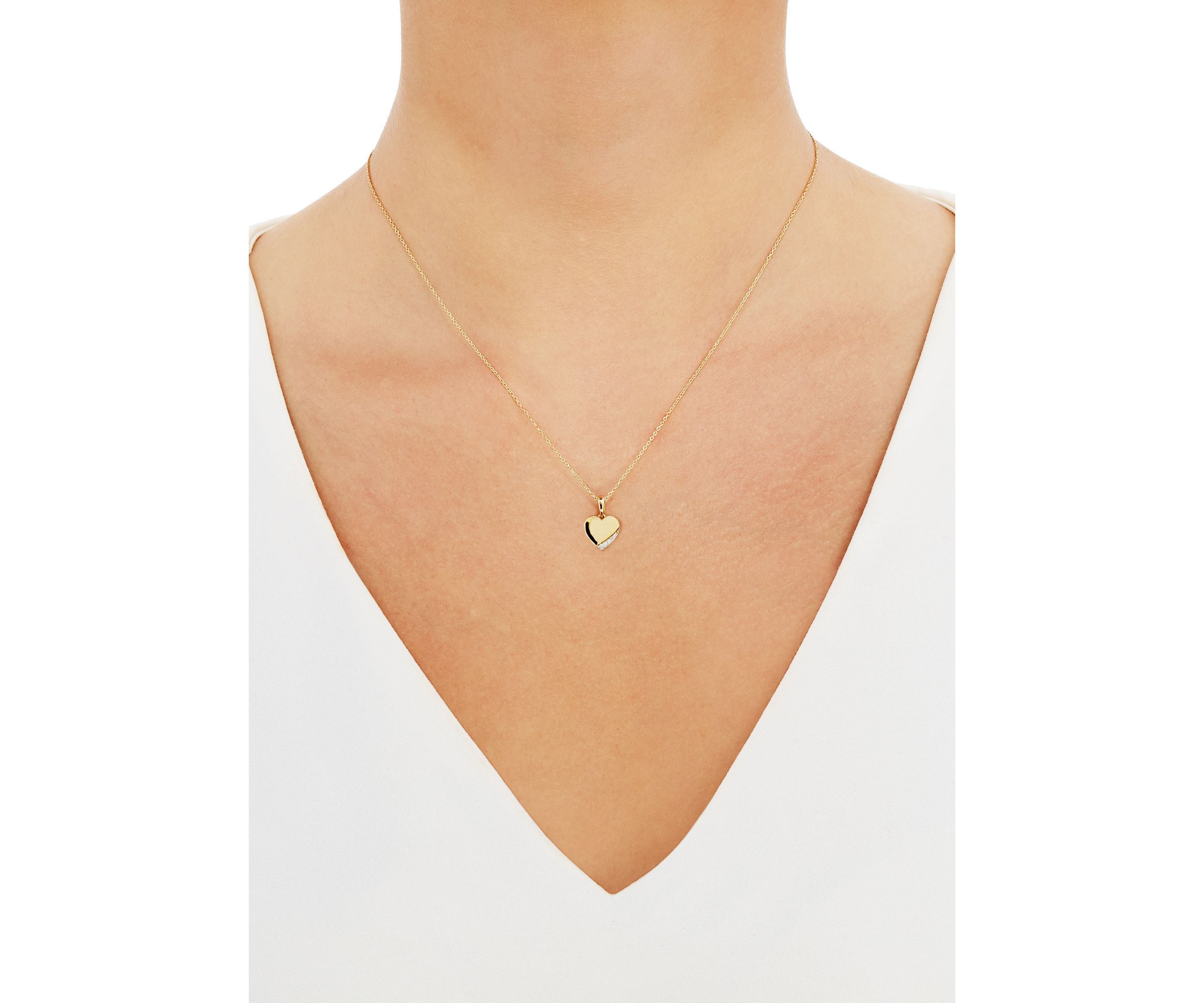  1/10 ct. t.w. Diamond Heart Pendant Necklace in 10K Yellow Gold 