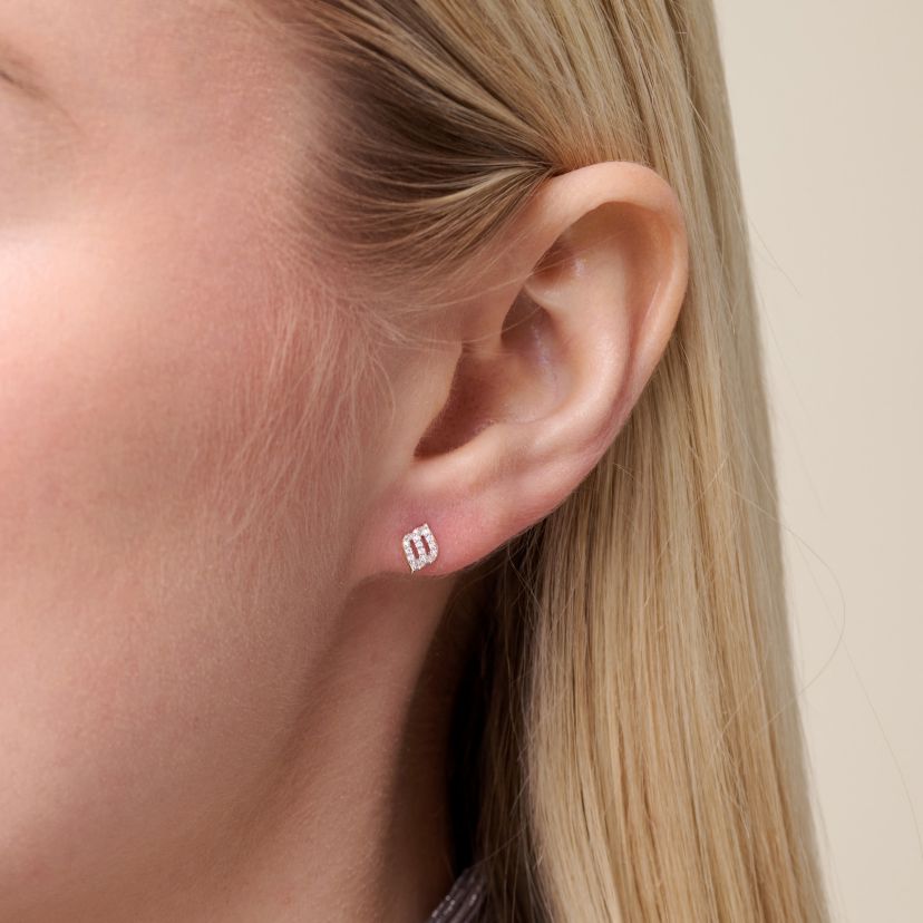 1/10 cttw Diamond Diagonal Swirl Stud Earrings in 14k Yellow Gold